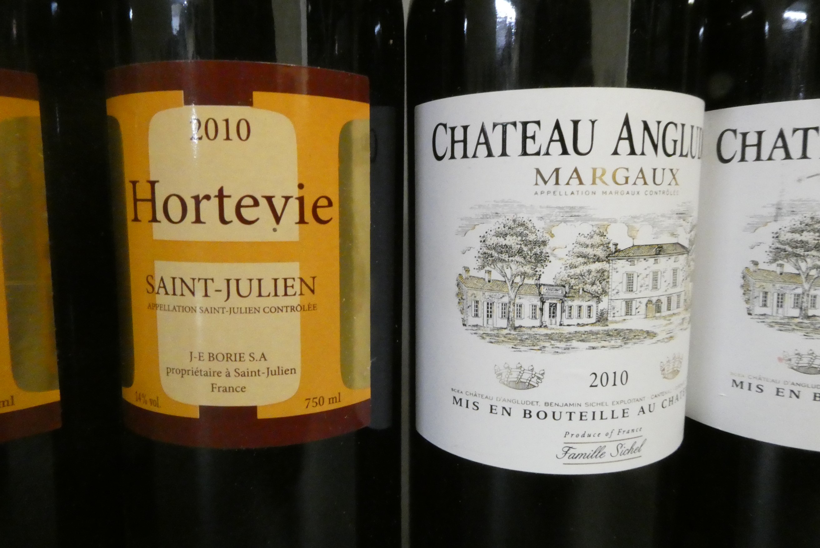 Seven bottles of Bordeaux Image