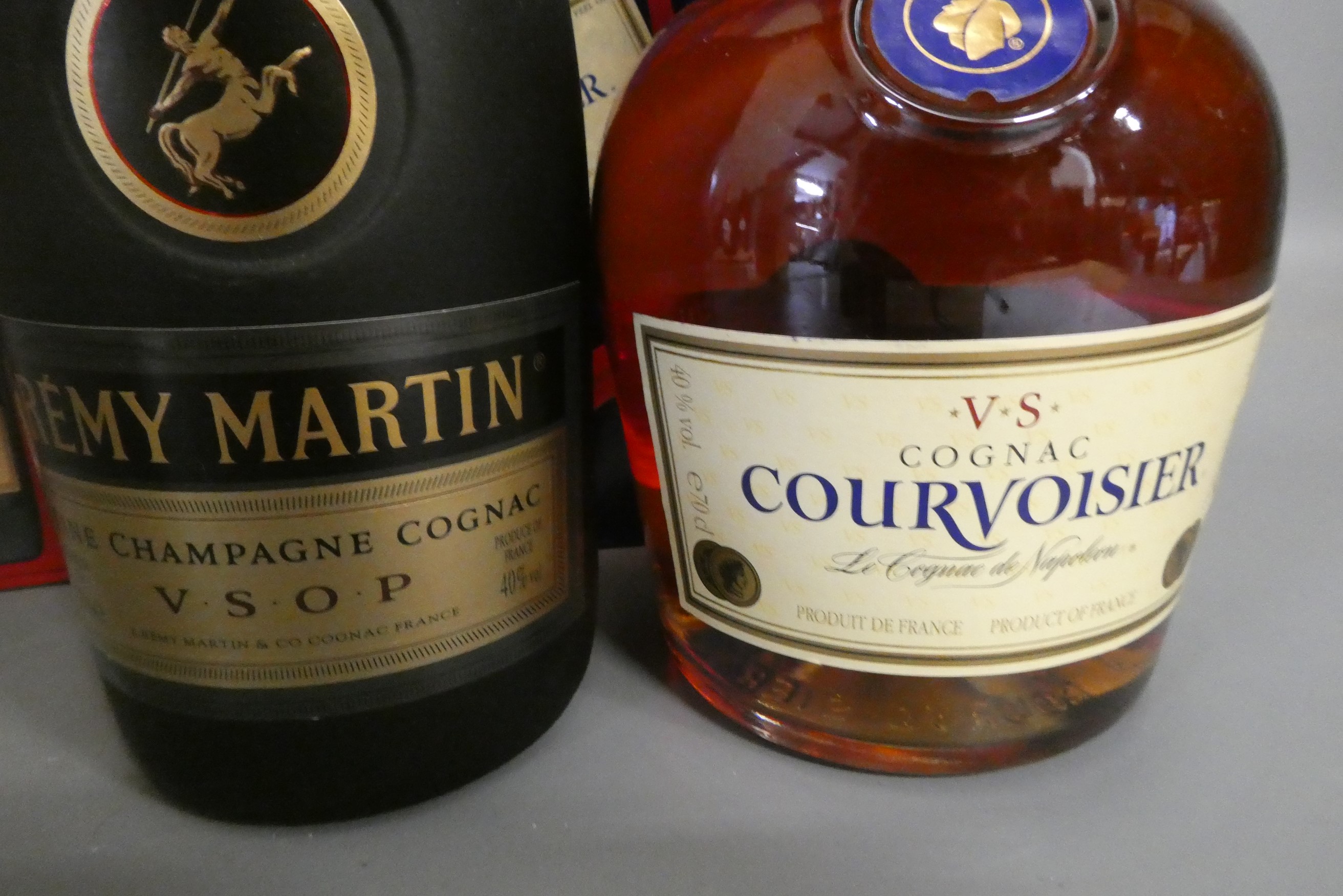 Two boxed bottles cognac, comprising a Remy Martin VSOP and a Courvoisier VS (Est. plus 24% premium Image