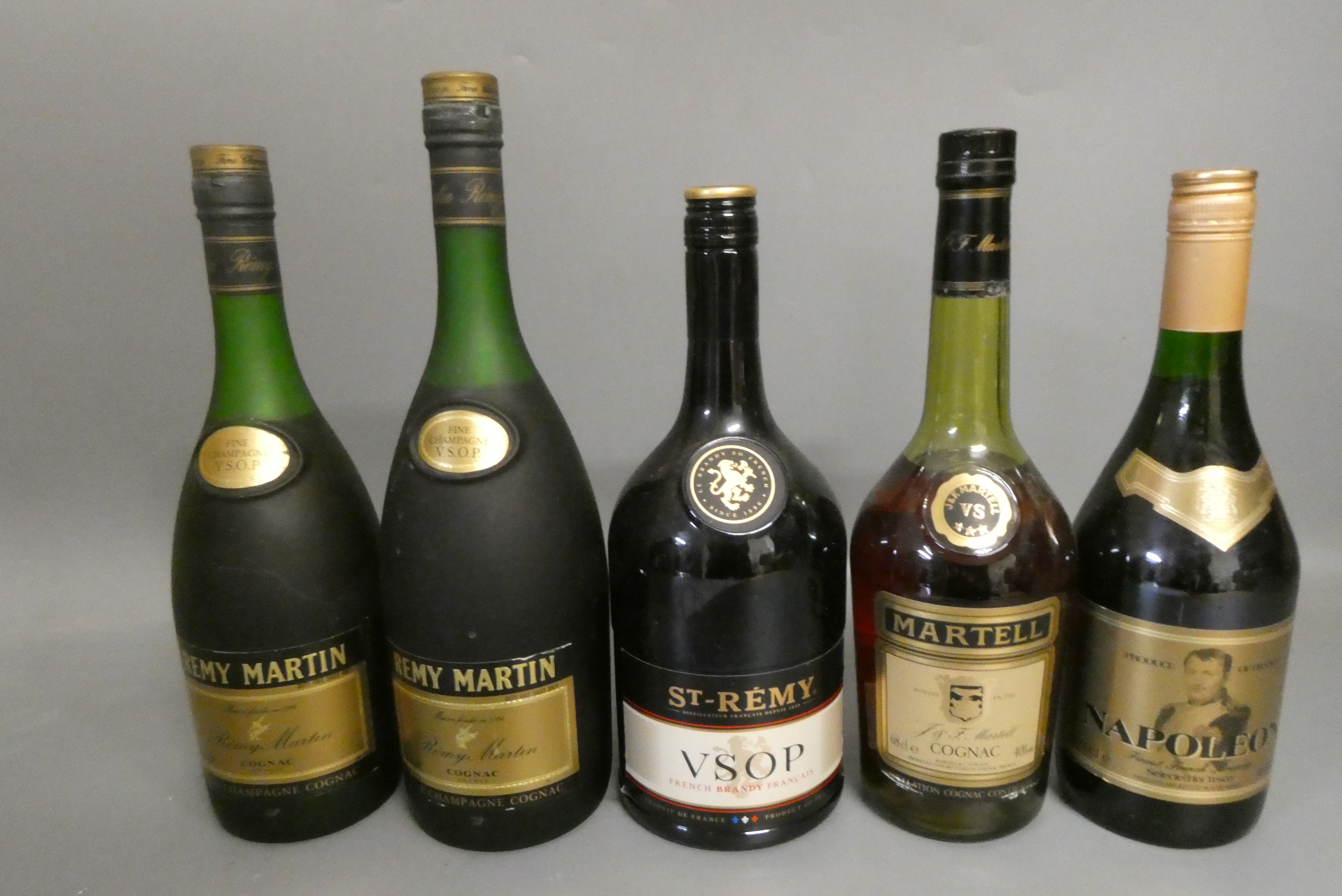 Five bottles of cognac and brandy Image