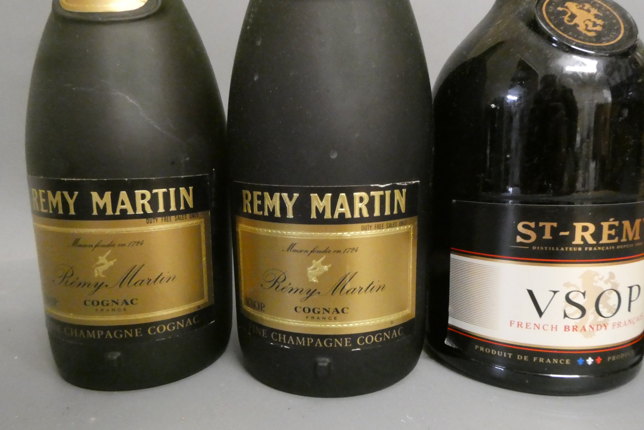 Five bottles of cognac and brandy Image