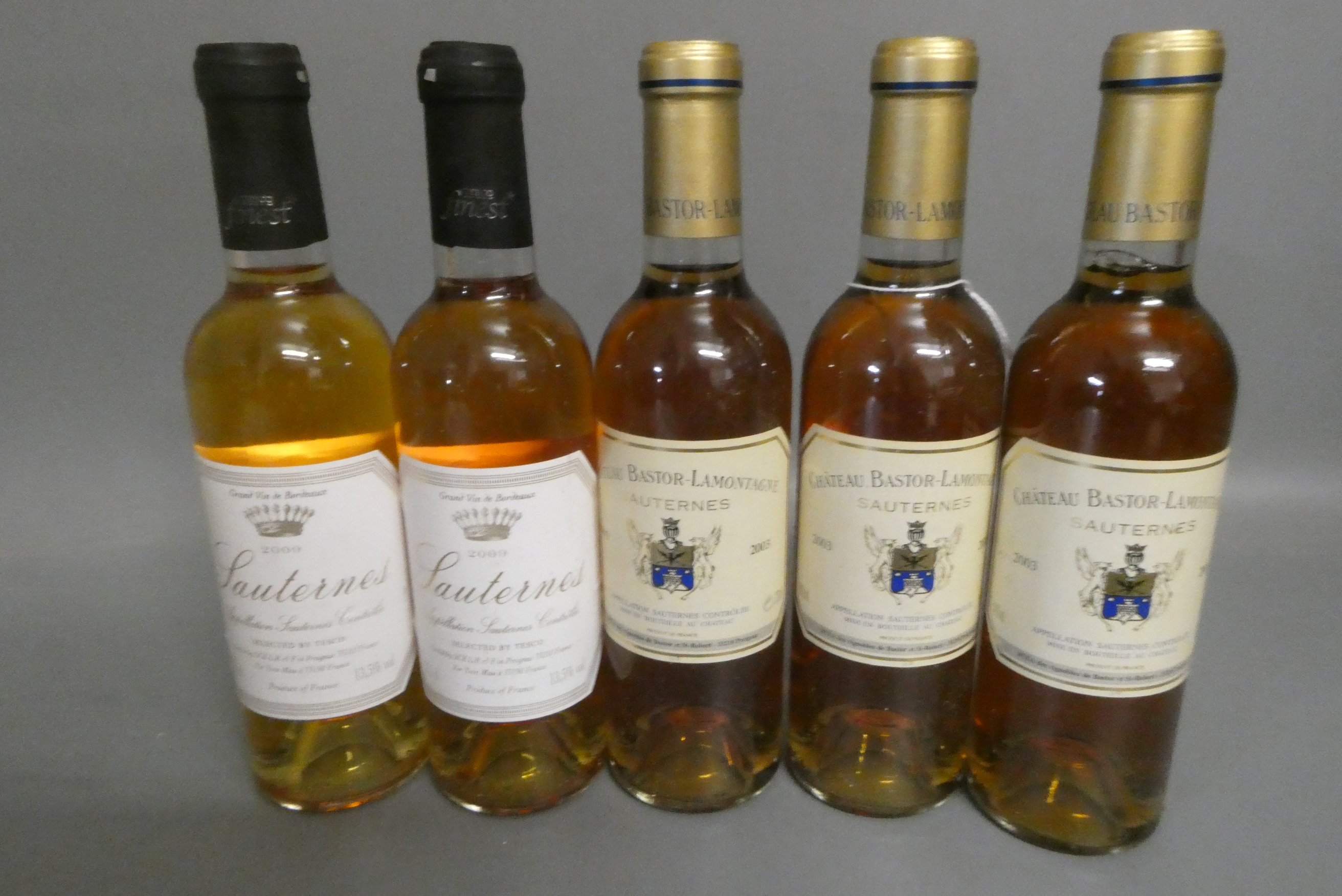 Five half bottles Sauternes, comprising three 2003 Chateau Bastor-Lamontagne and two 2009 Sauternes Image