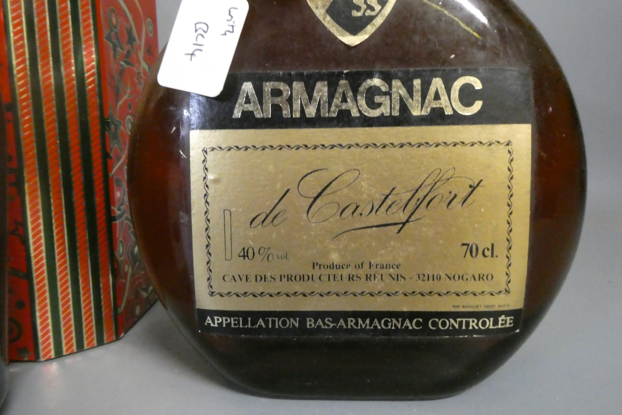 Three bottles of cognac & armagnac comprising a boxed Courvoisier VS cognac, a boxed 12yr old Image