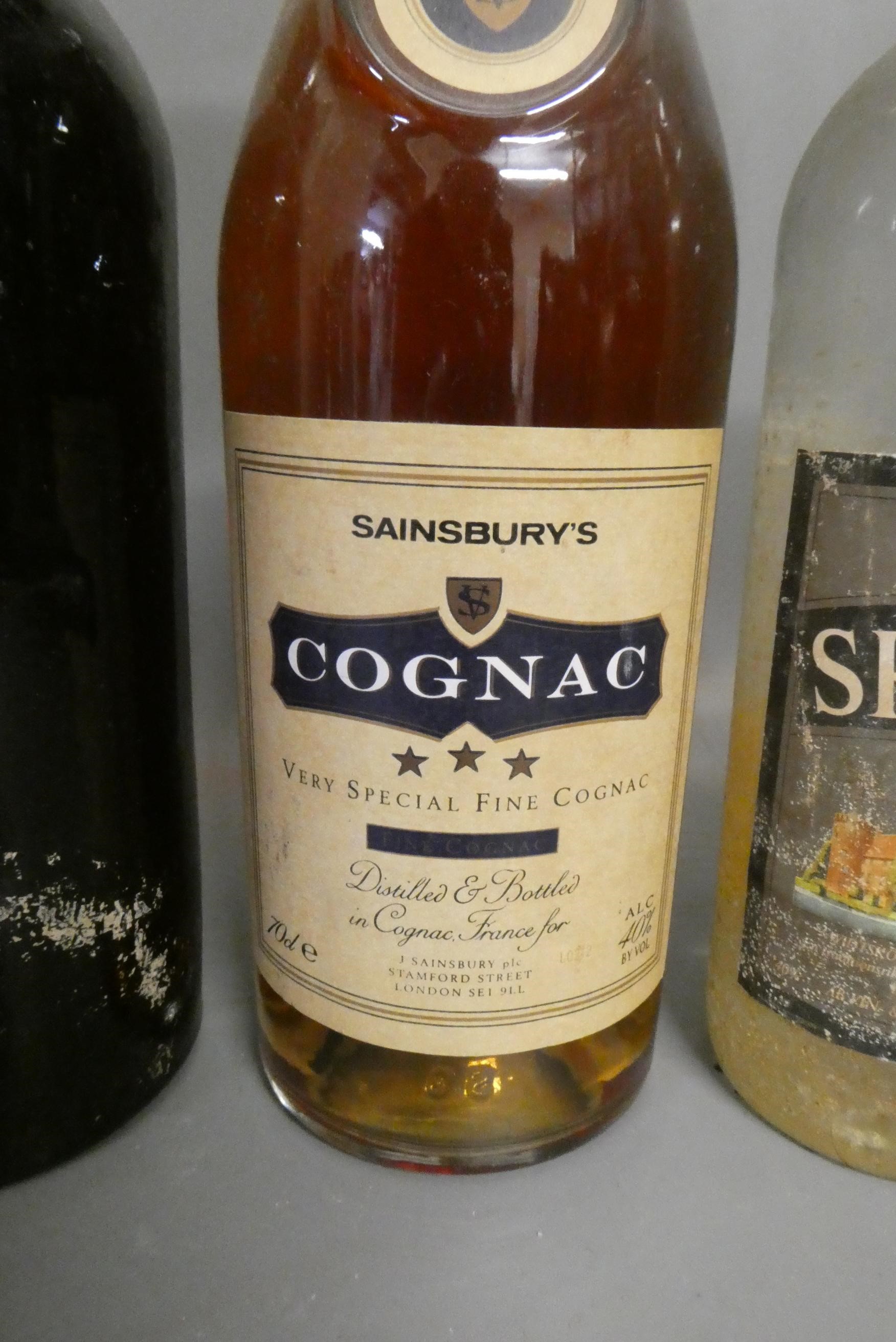 Five bottles and two miniatures of mixed port and liqueur Image