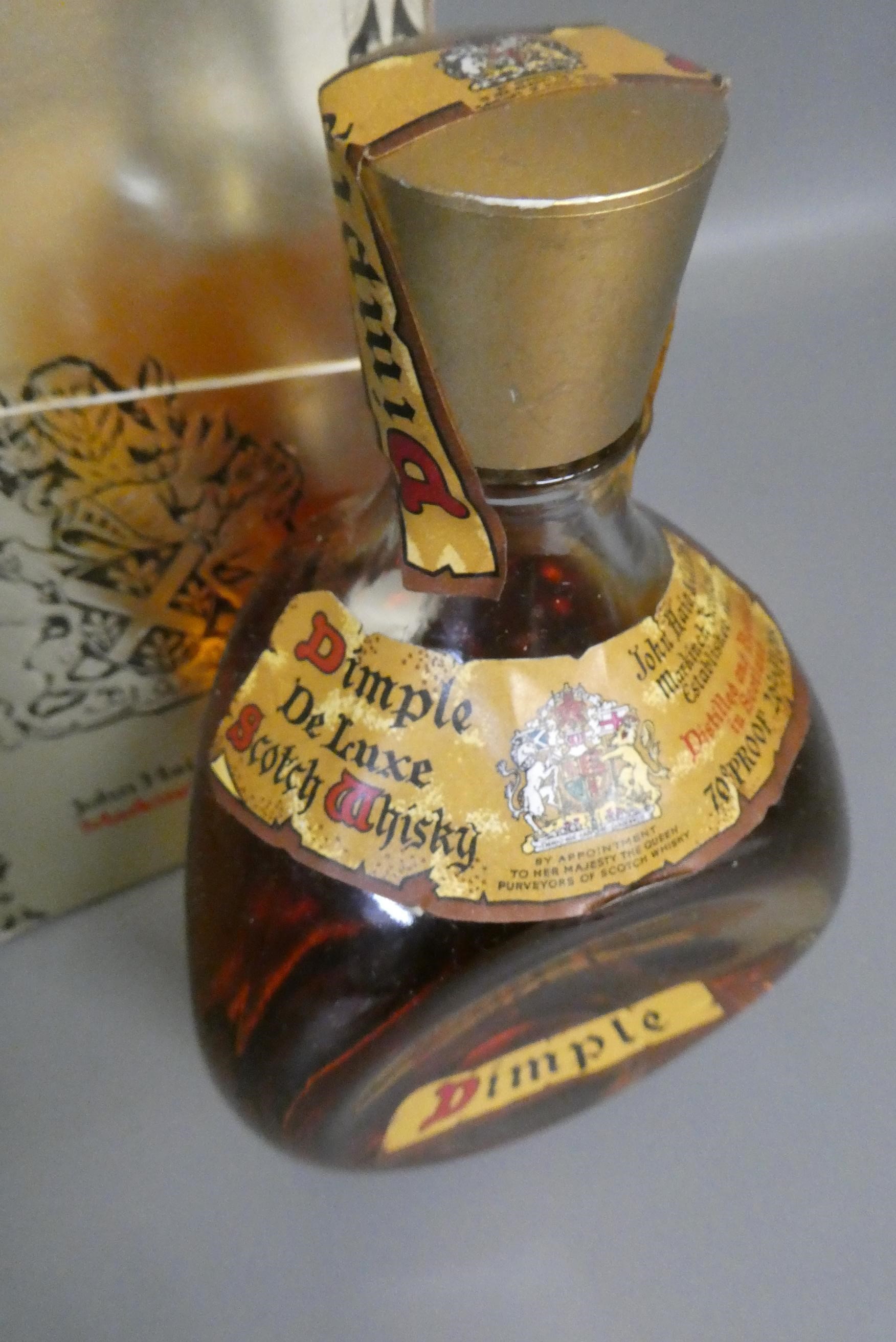 One bottle Dimple Haig deluxe scotch whisky, 70°, 26 2/3fl.ozs, boxed (Est. plus 24% premium inc. Image