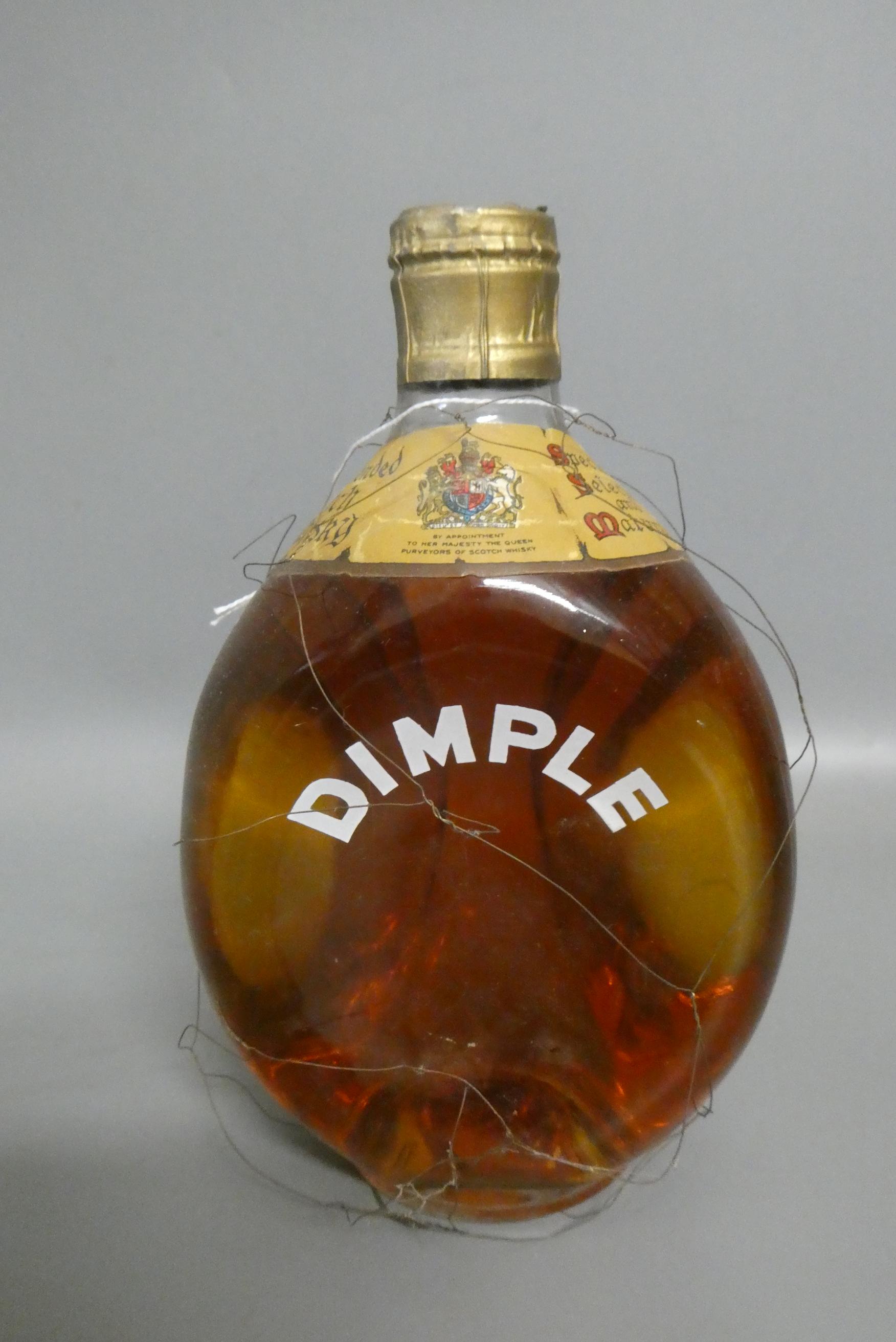 Vintage bottle of Dimple Haig whisky, with snap cap top, 20.4cm tall (Est. plus 24% premium inc. Image