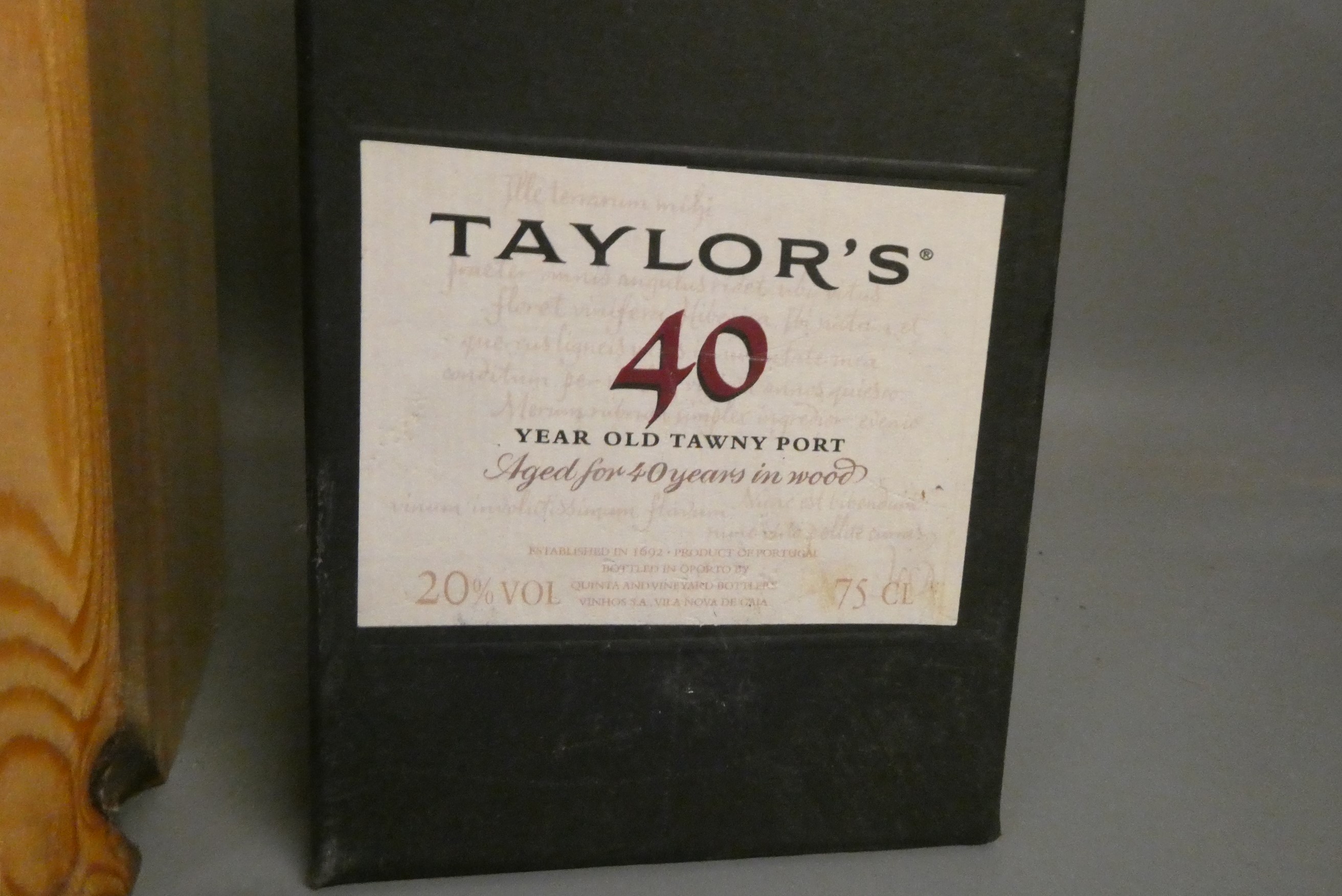 Three boxed bottles comprising a Laphroaig triple wood single malt whisky, a Taylor's 40yr old tawny Image