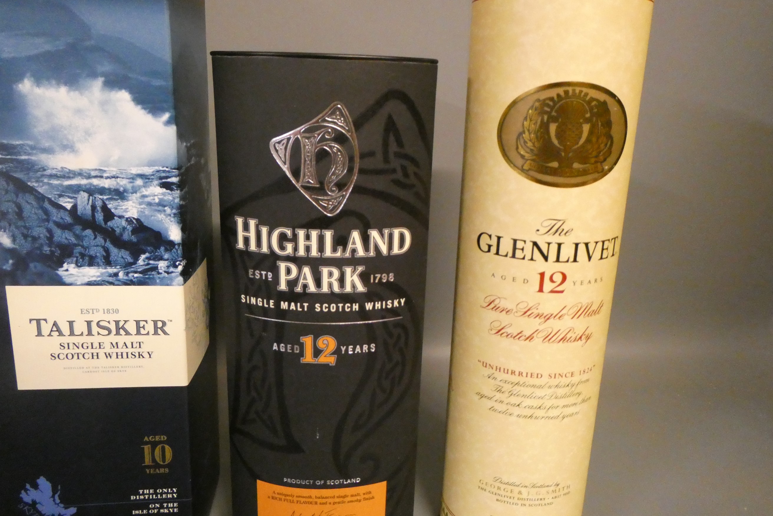 Five boxed bottles of single malt scotch whisky, comprising one Jura Journey, Highland Park 12yr Image