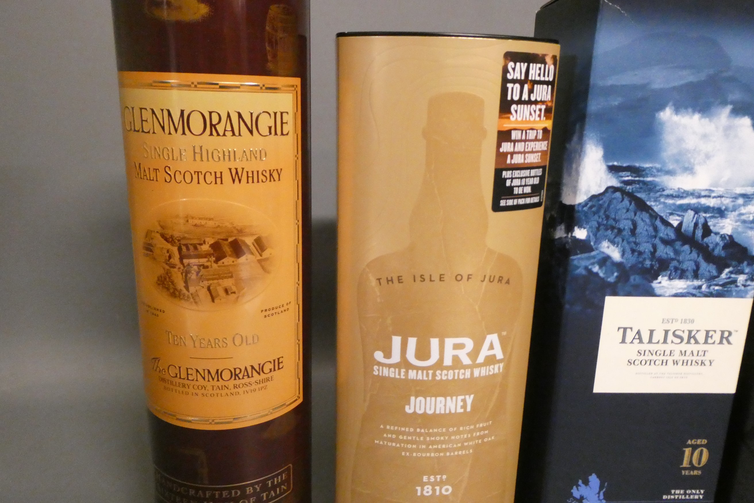 Five boxed bottles of single malt scotch whisky, comprising one Jura Journey, Highland Park 12yr Image