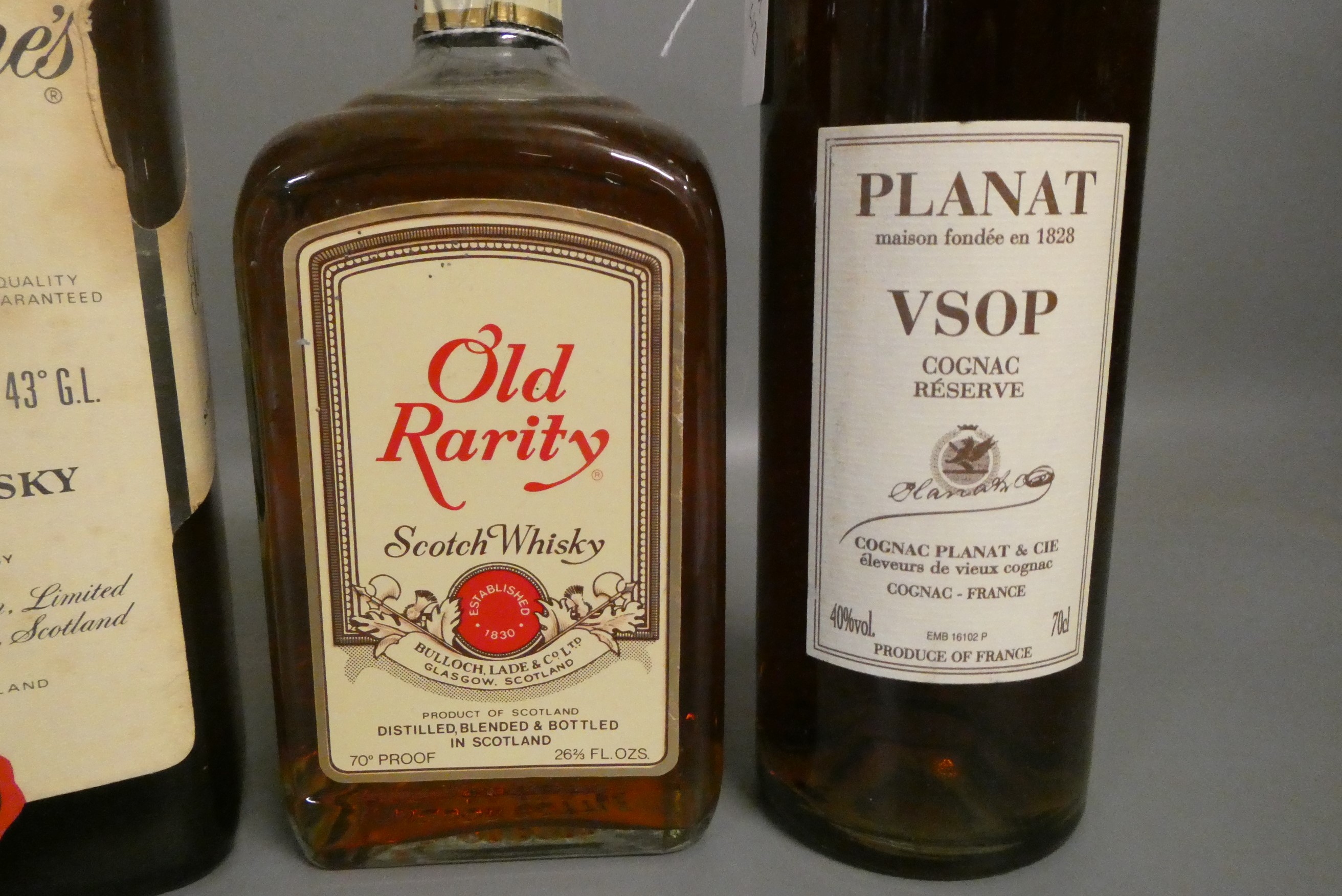 Three bottles of vintage whisky Image