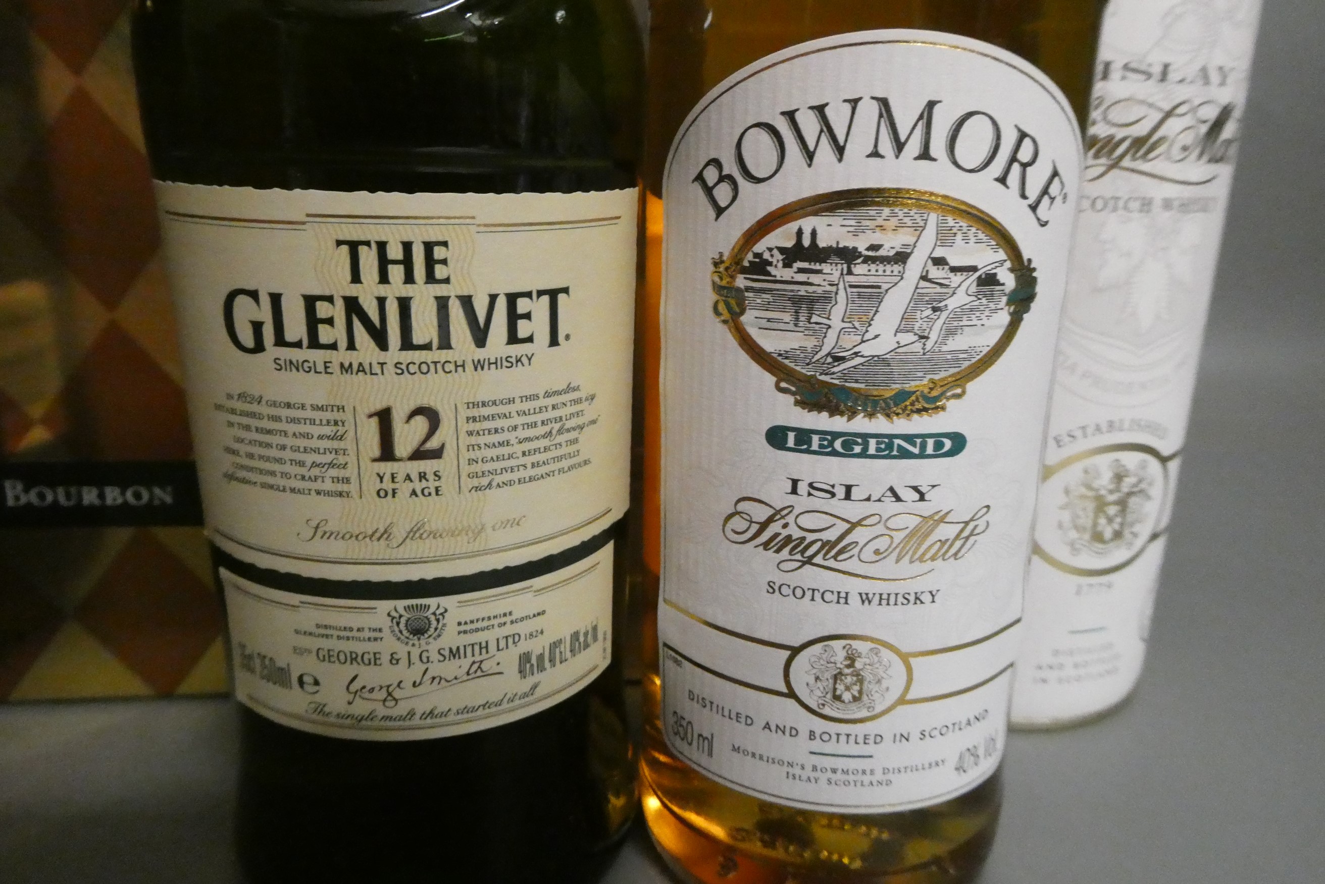 Three bottles of boxed whisky, comprising 1litre Woodford Reserve bourbon, batch 228, bottle 4836, a Image