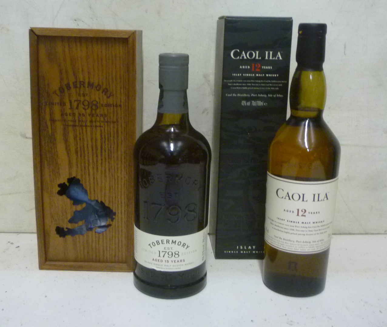 One bottle Tobermory 15 year old Island Single Malt (owc) and one bottle Caol Ila 12 year old Islay Image