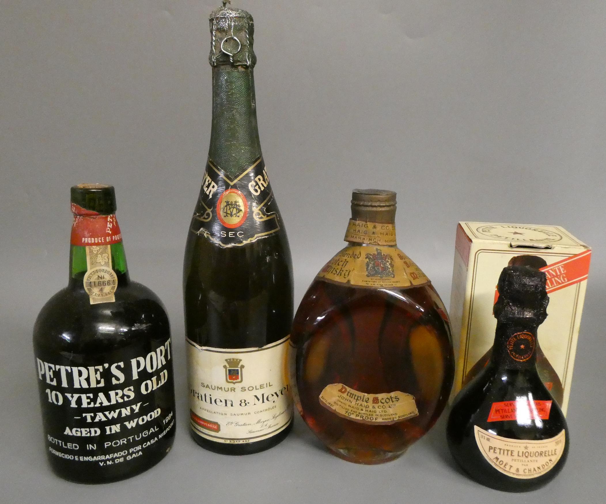 4 bottles of mixed alcohol Image