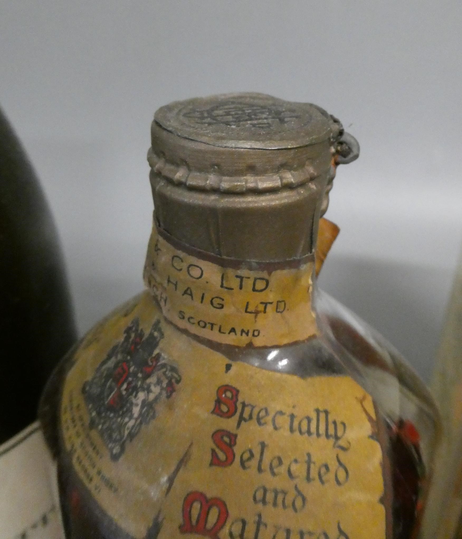 4 bottles of mixed alcohol Image