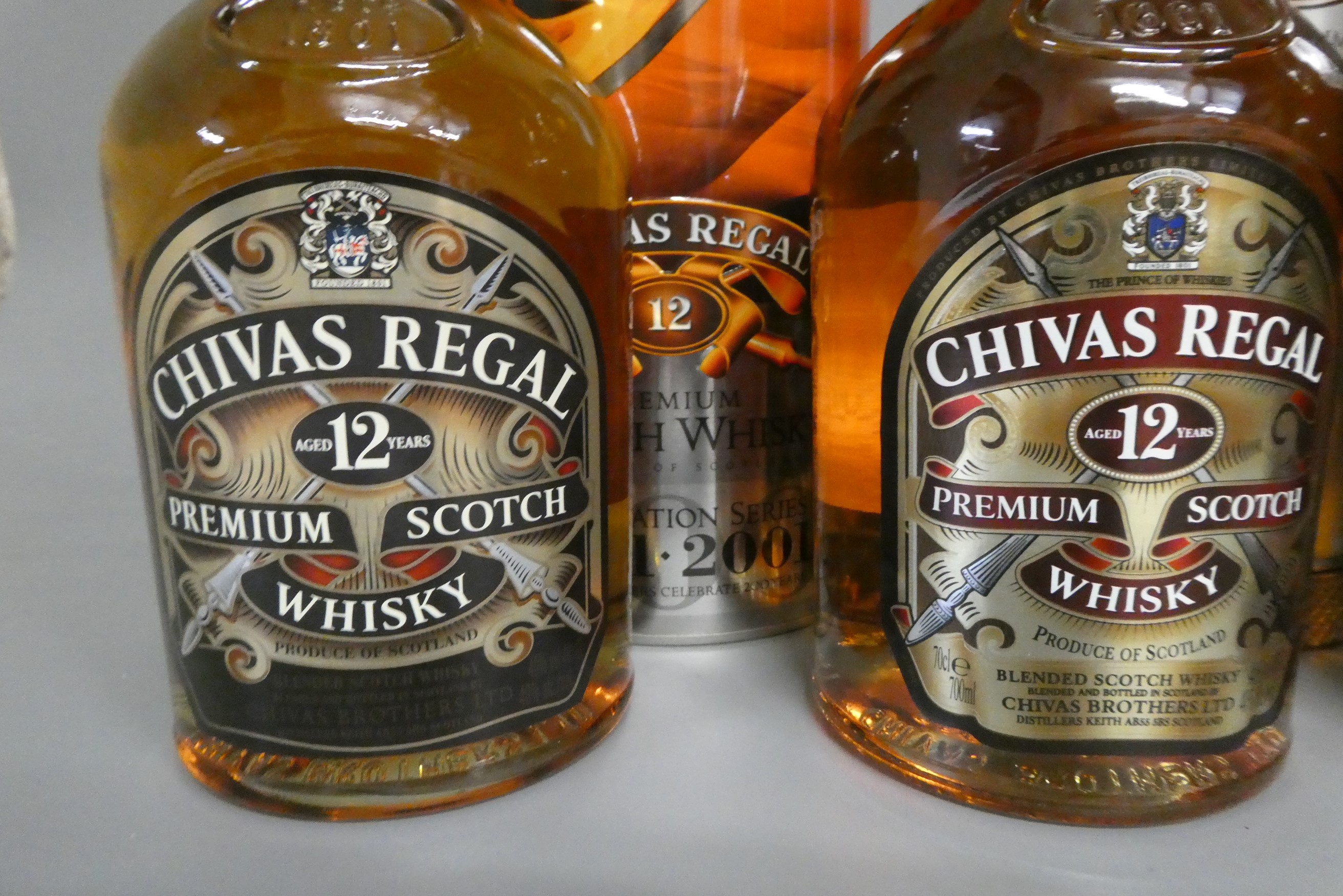 4 bottles of Chivas Regal scotch whisky, comprising 1 litre boxed 12 year old premium whisky, 2 70cl Image
