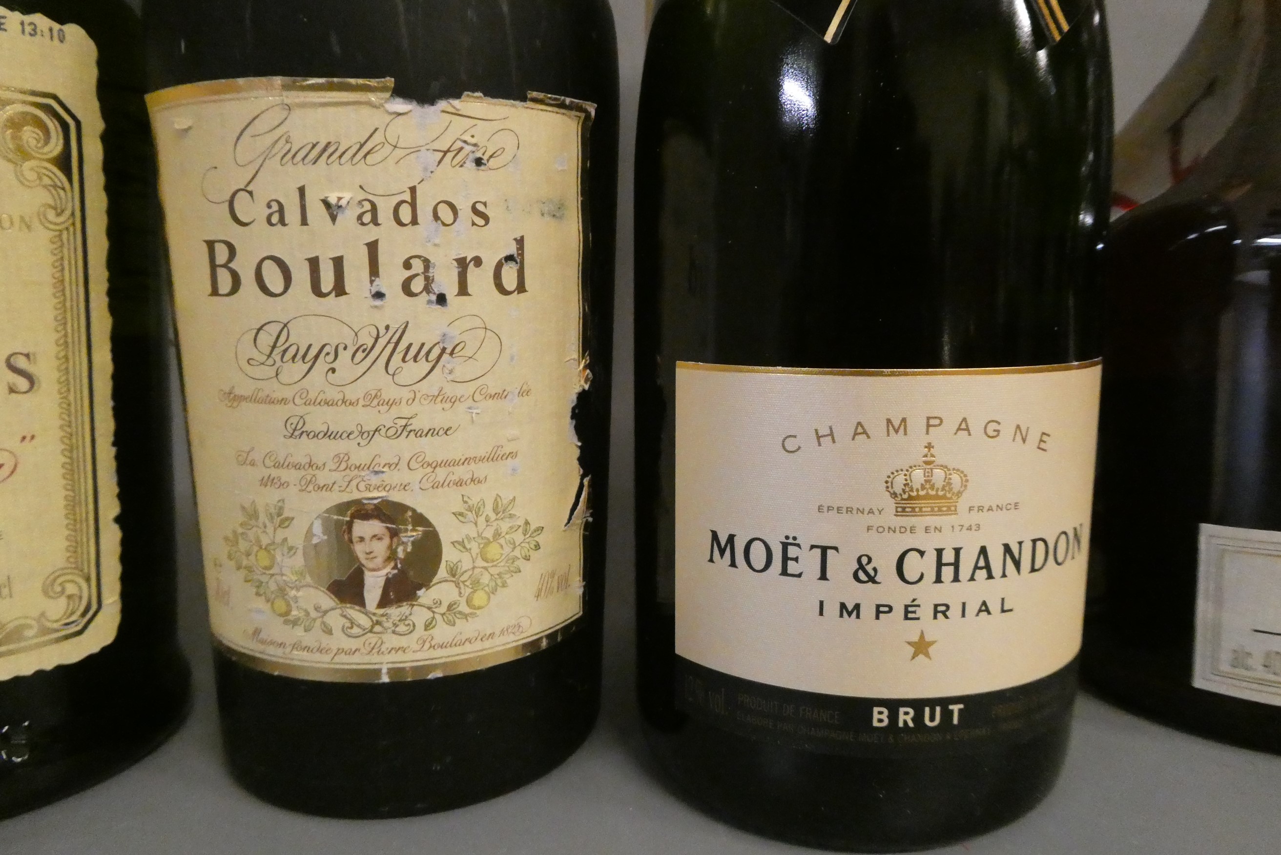 10 bottles of mixed alcohol, including Moet & Chandon champagne, Five Kings brandy, Fine Calvados, Image