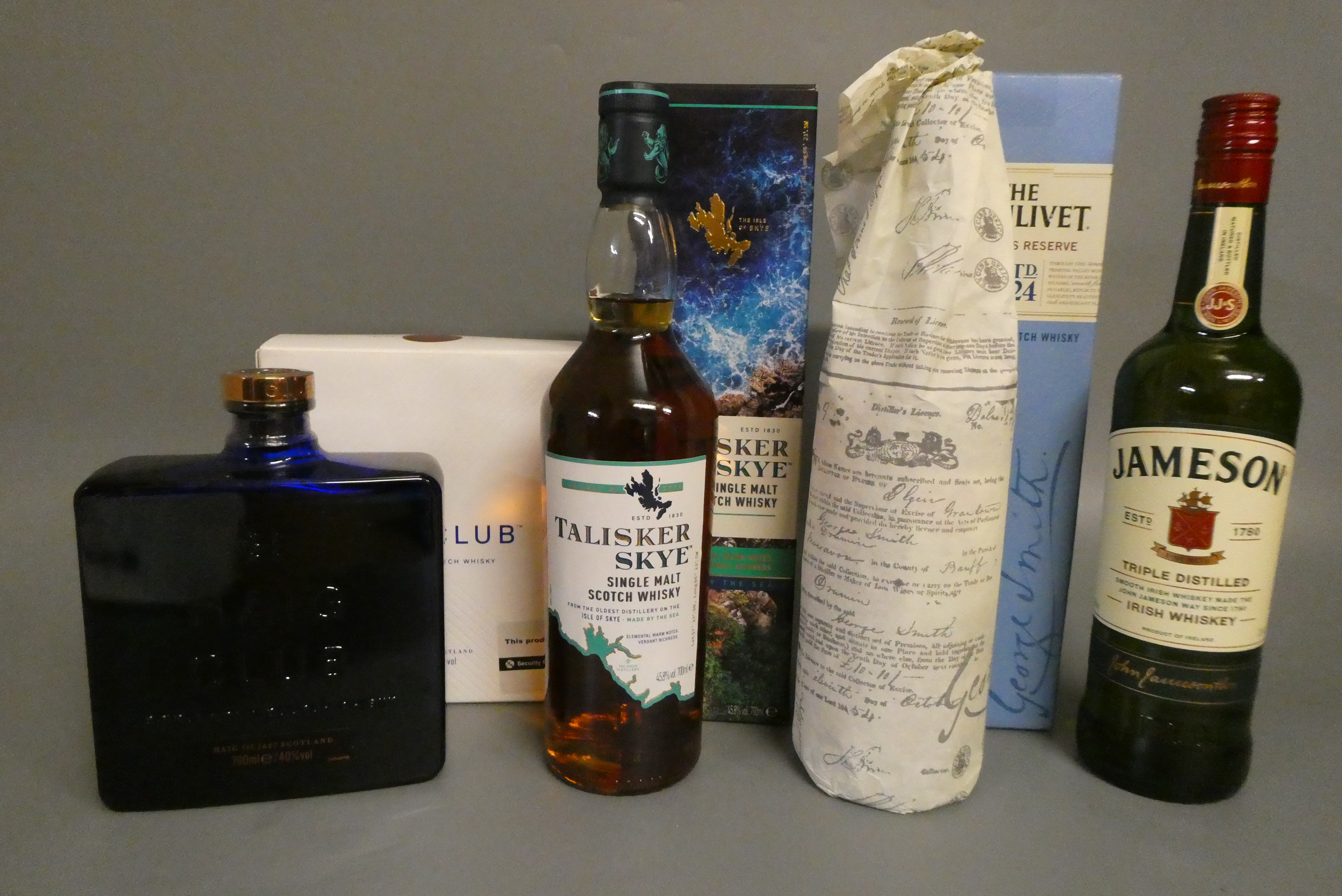 4 bottles of whisky Image