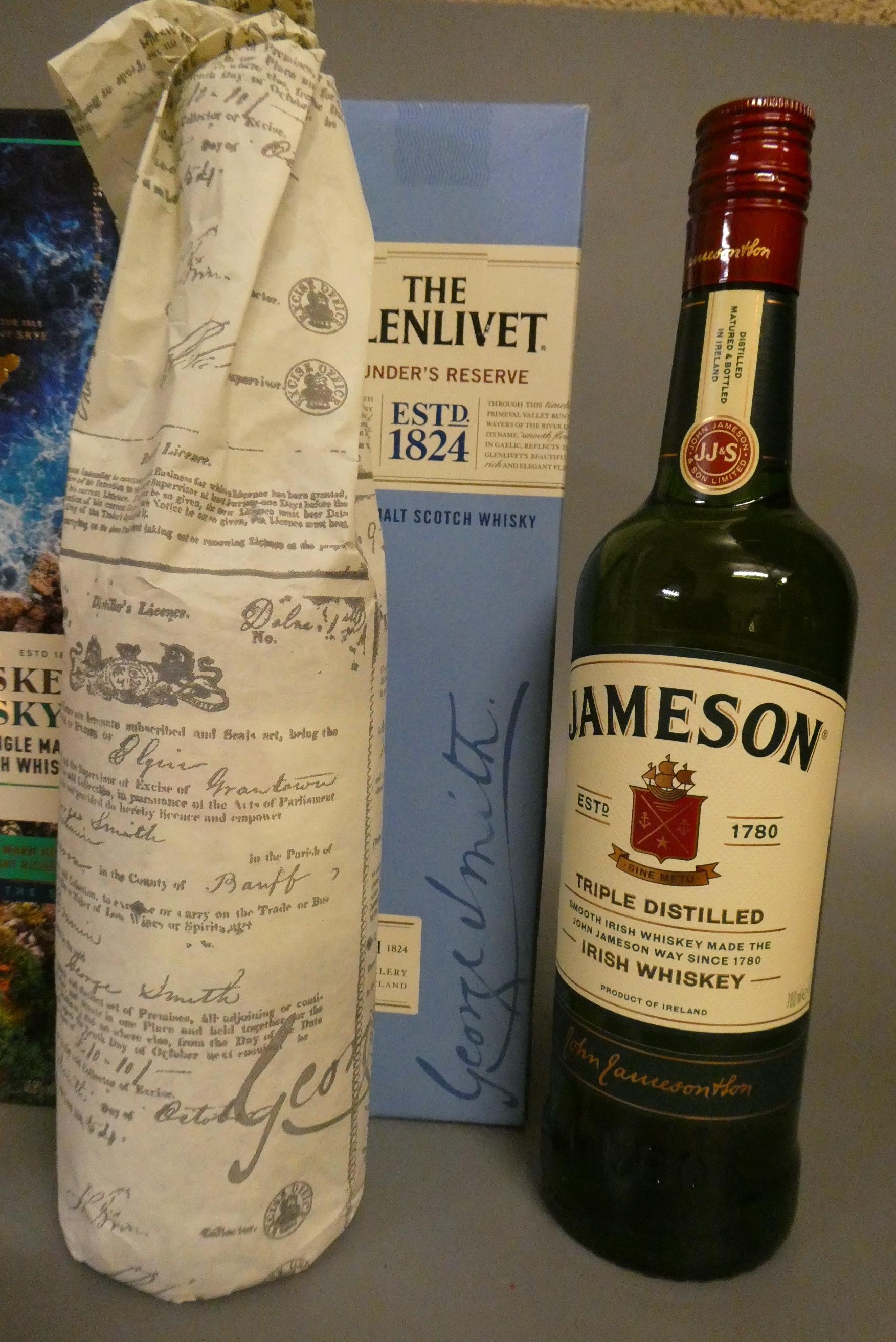 4 bottles of whisky Image