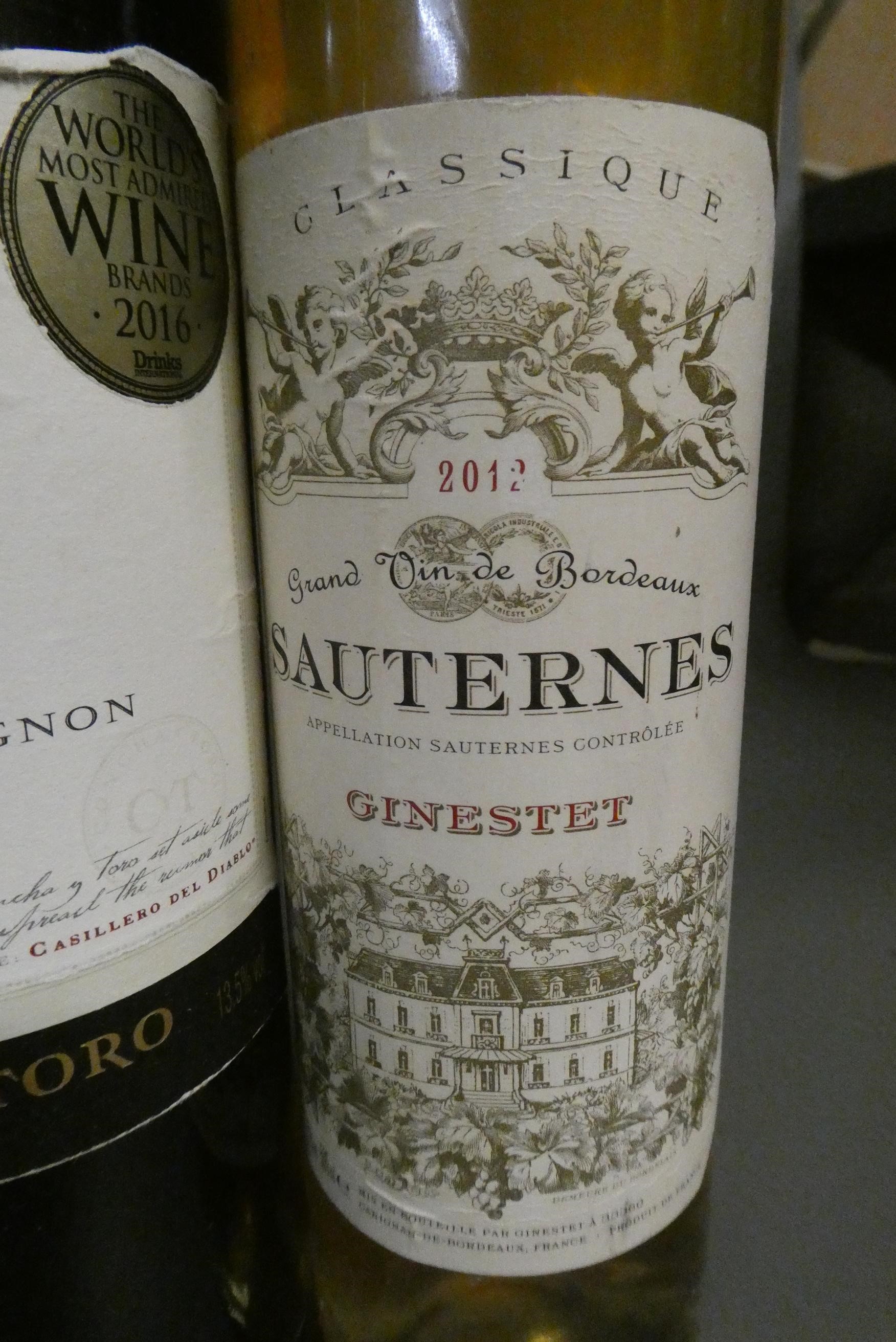 7 bottles of mixed alcohol Image