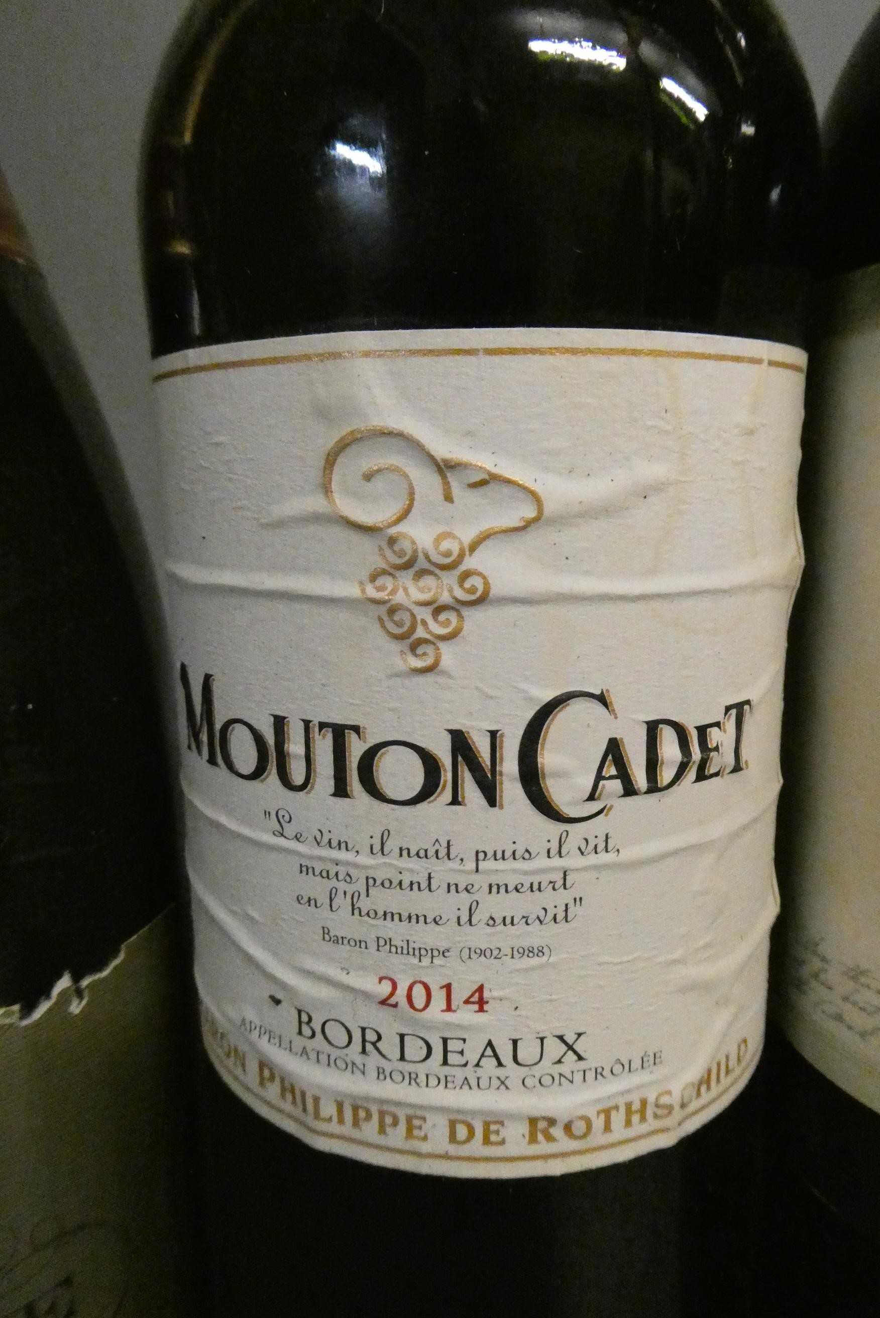 7 bottles of mixed alcohol Image