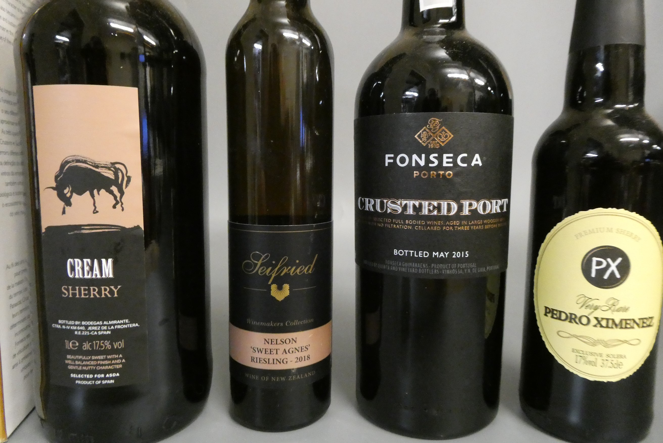 7 bottles of mixed alcohol Image