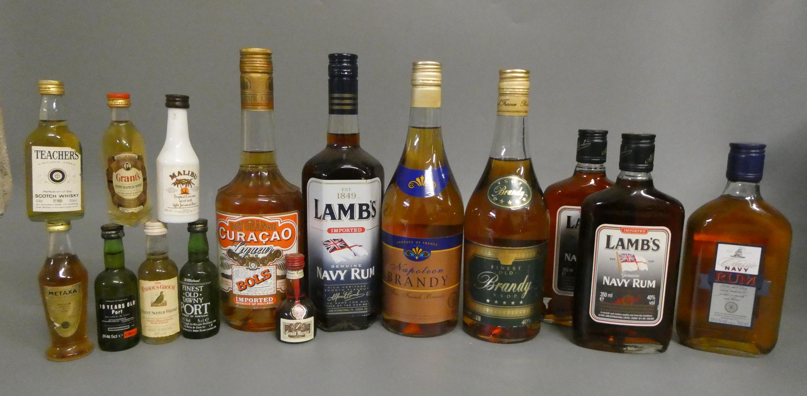 A collection of mixed spirits and liqueur, including Lambs navy rum, Classic navy rum, Napoleon Image