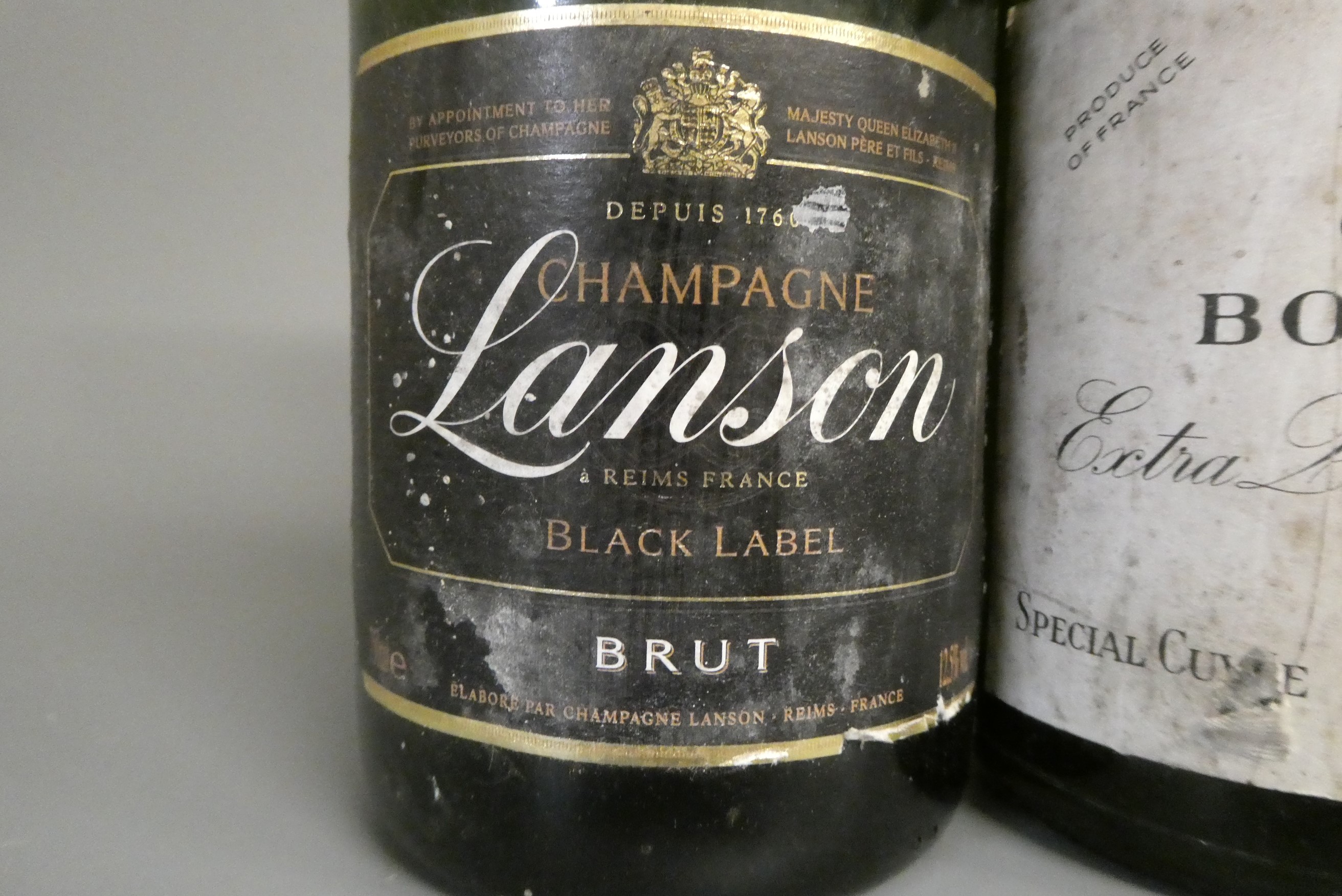 2 bottles of late 1970s champagne, comprising Bollinger extra quality very dry and a Lanson black Image