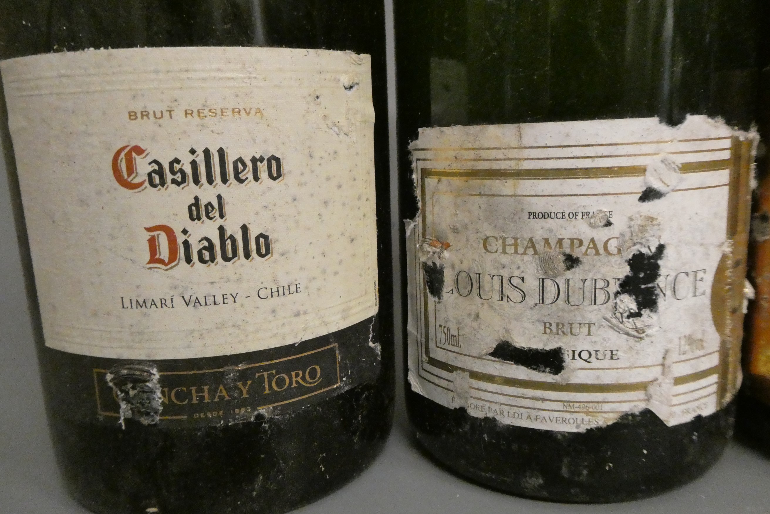 8 bottles of sparkling wine Image