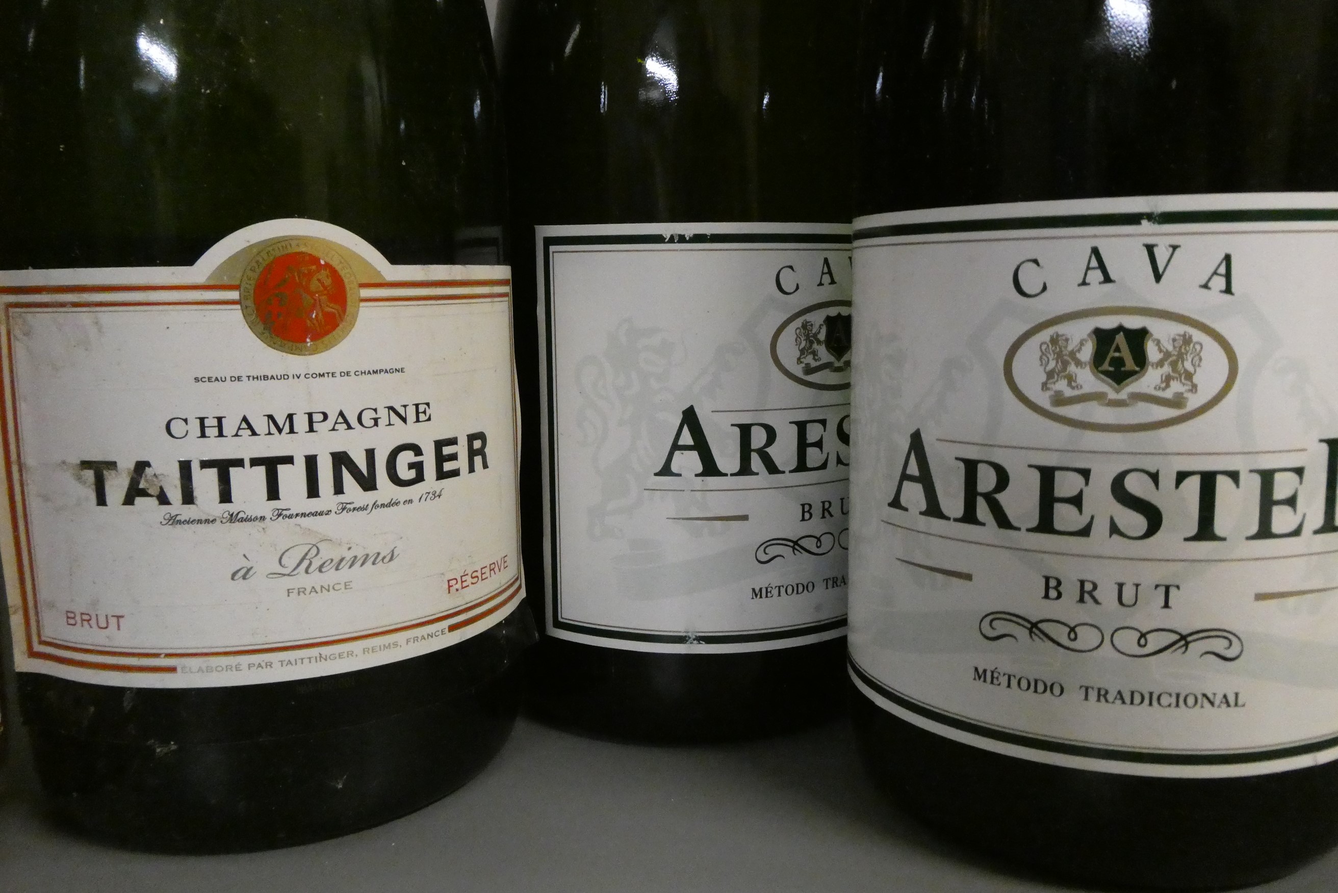8 bottles of sparkling wine Image