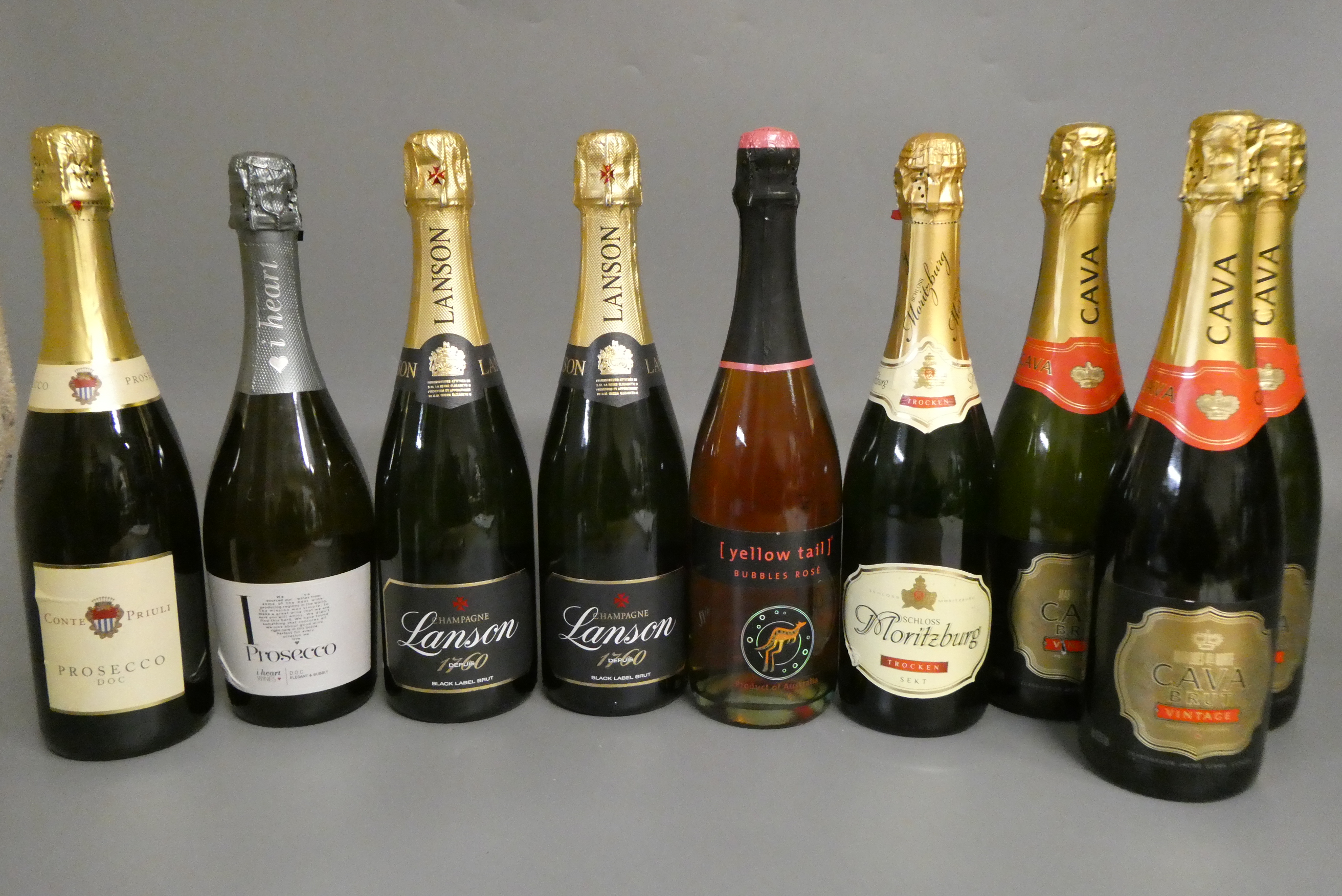 9 bottles sparkling wine Image