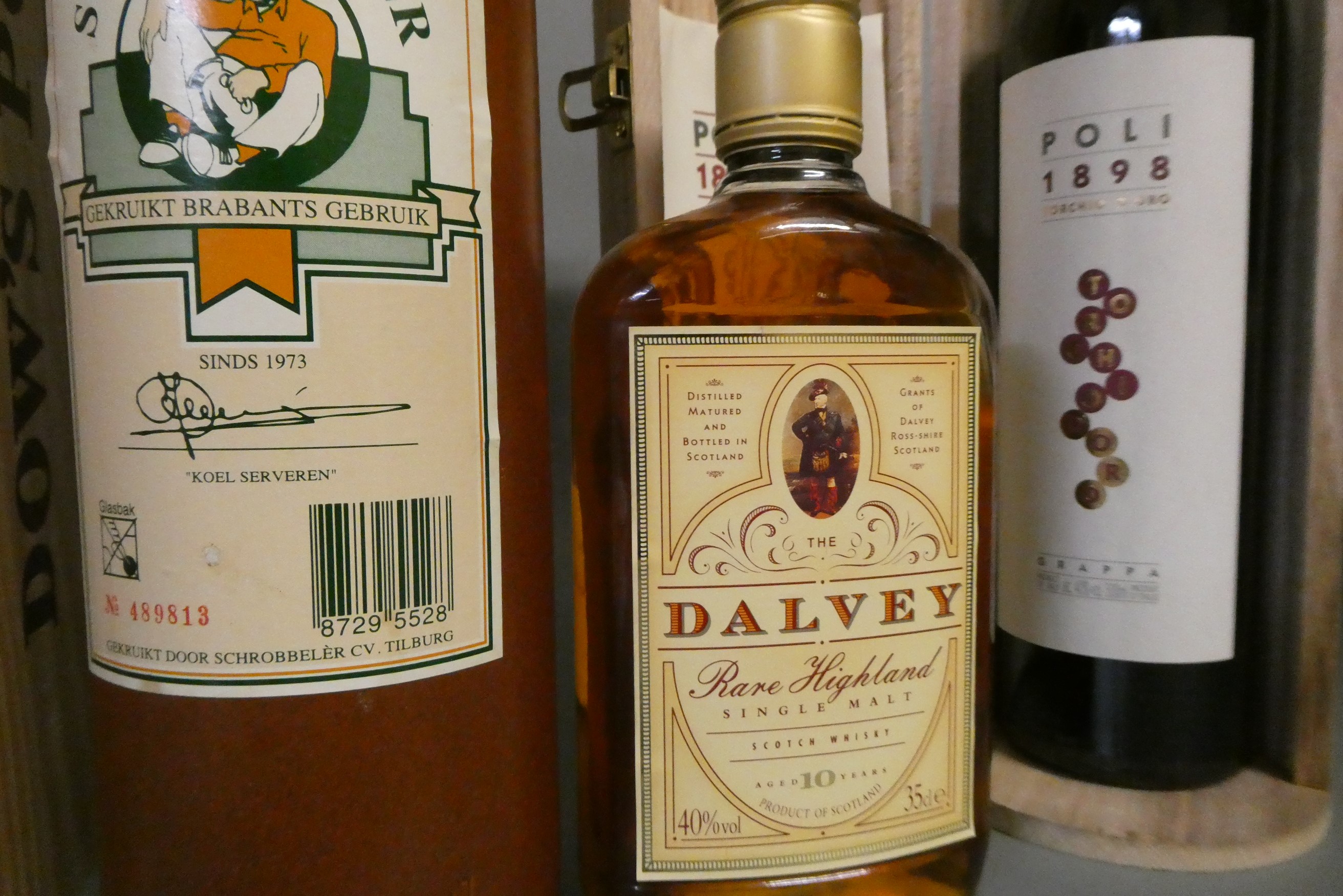 7 bottles of mixed alcohol Image