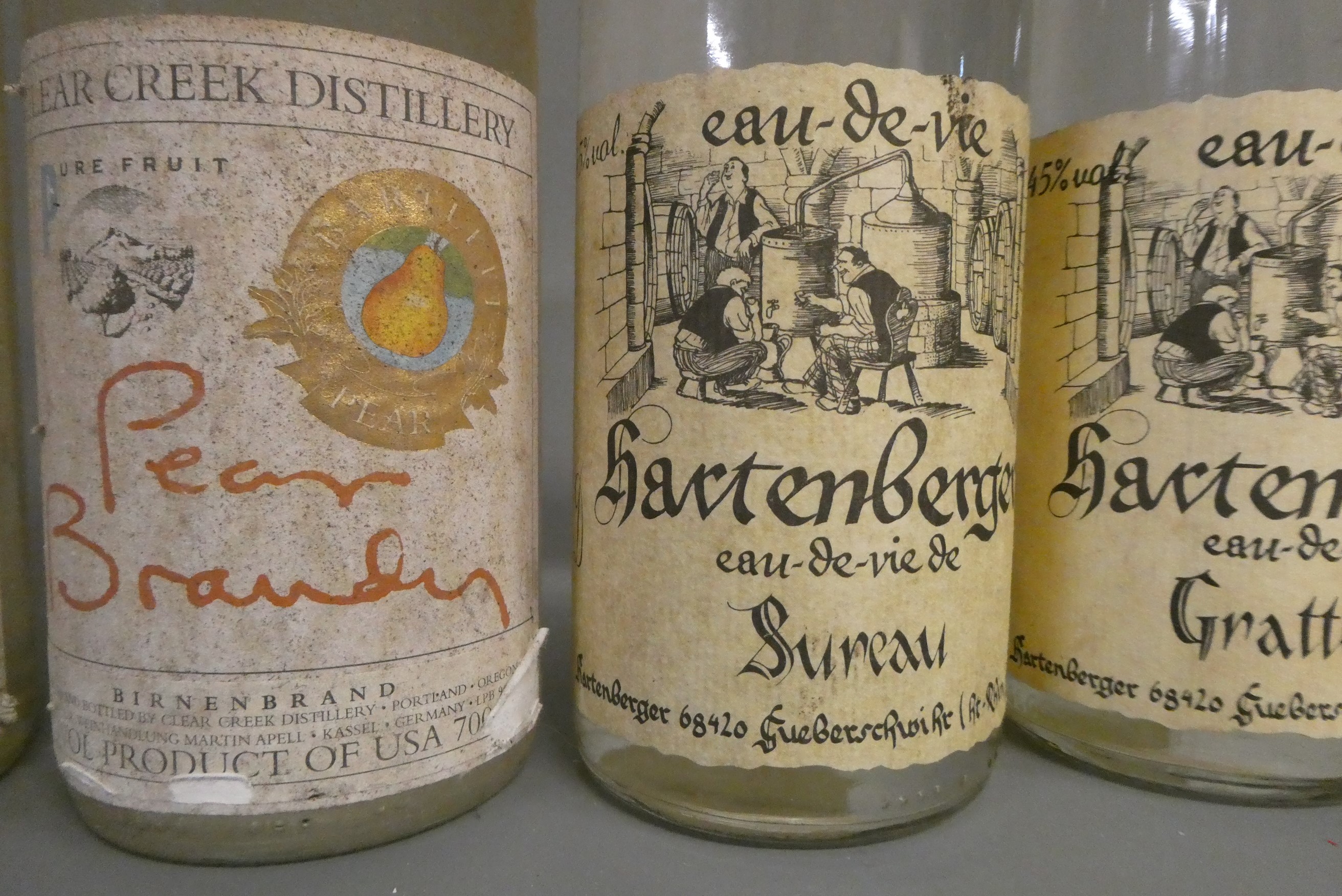4 bottles Hartenberger Eau-de-Vie de Coing, 40%, together with 2 Clear Creek Distillery Pear Brandy Image