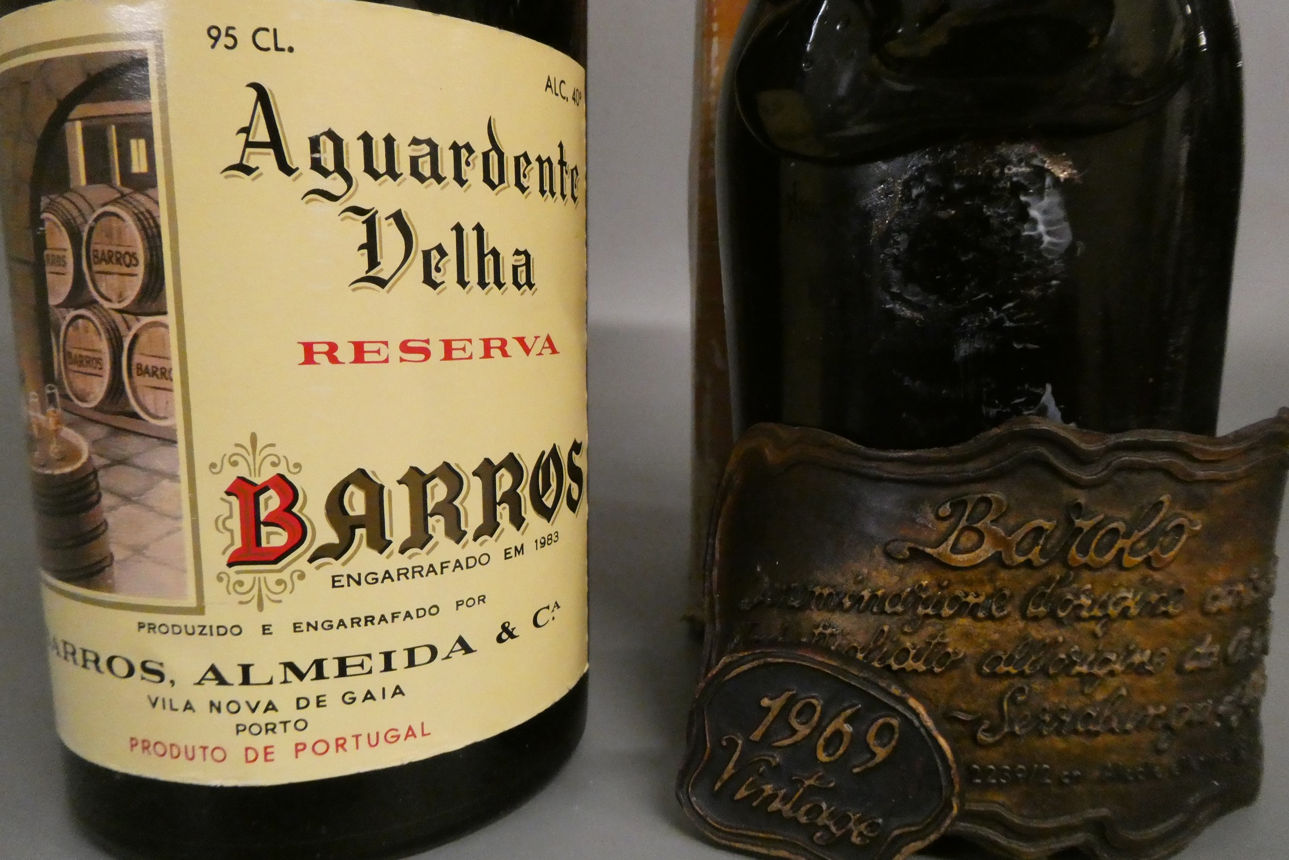 2 bottles of European, comprising 1 Aguardente Velha reserva and 1 bottle 1969 vintage Barolo, both Image