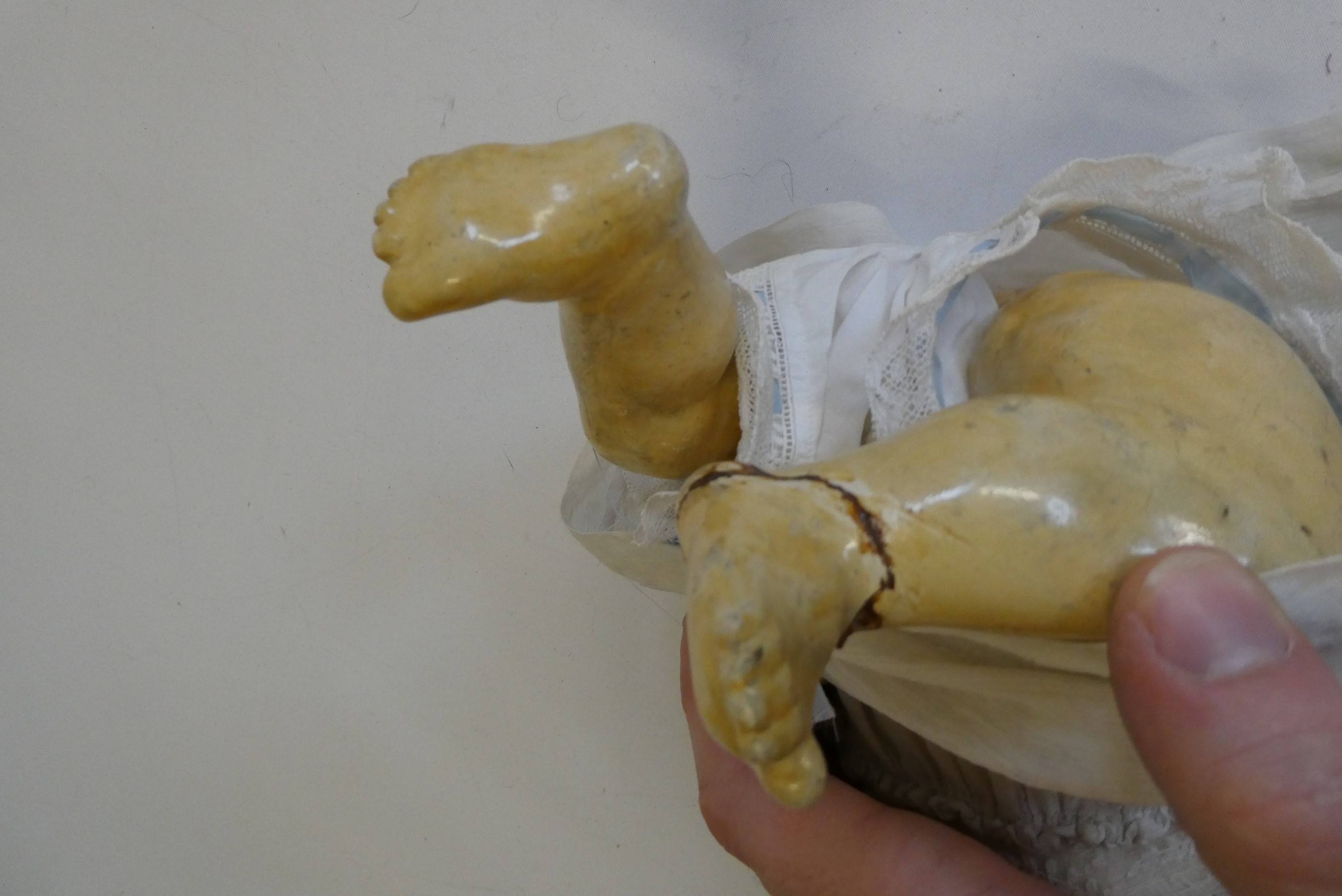 A German bisque socket head character doll, with brown glass fixed eyes, moulded grinning teeth, Image