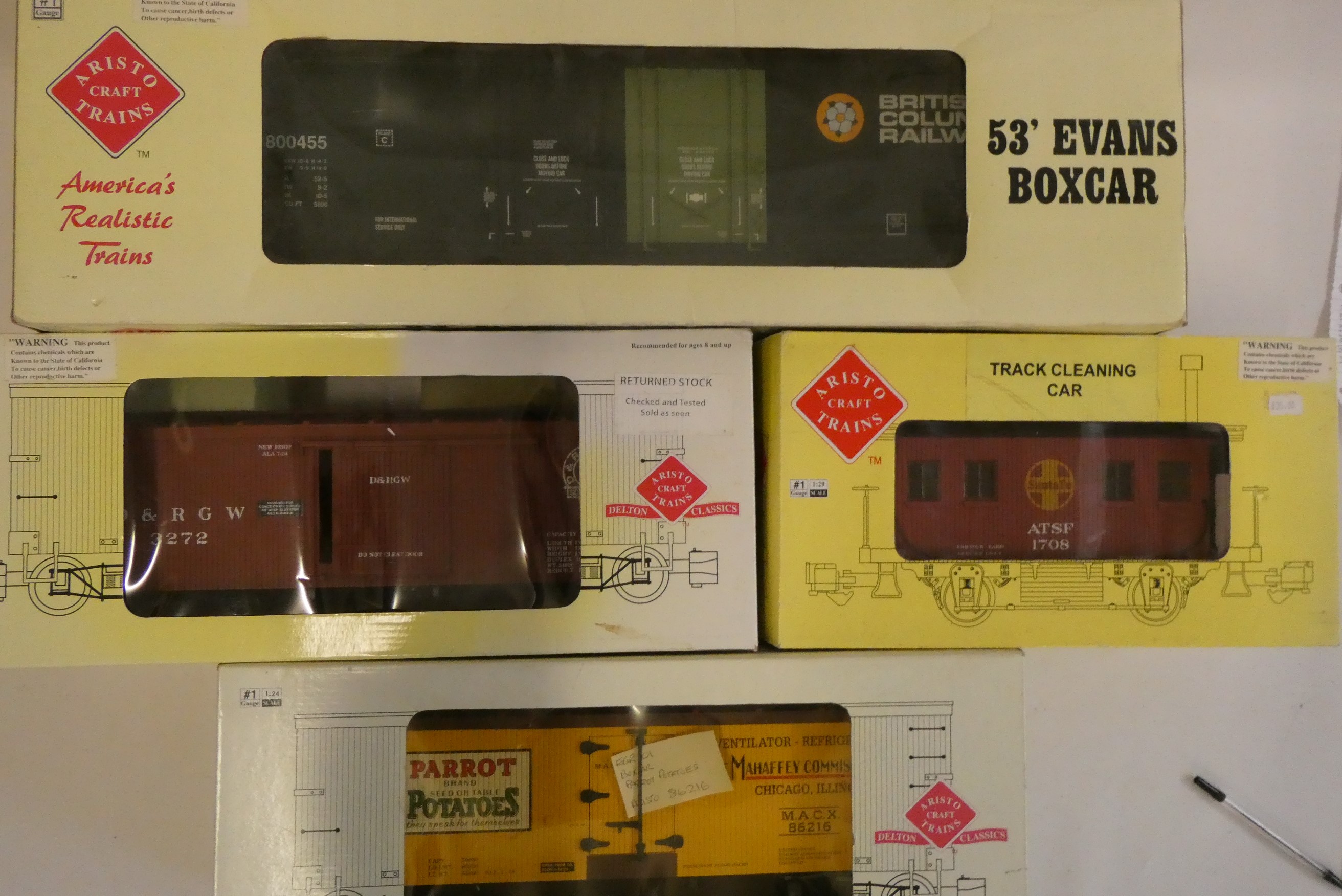 Eight Aristocraft and US Trains box cars including circus car, Murphy's Irish Stout, Pluto Water, Image