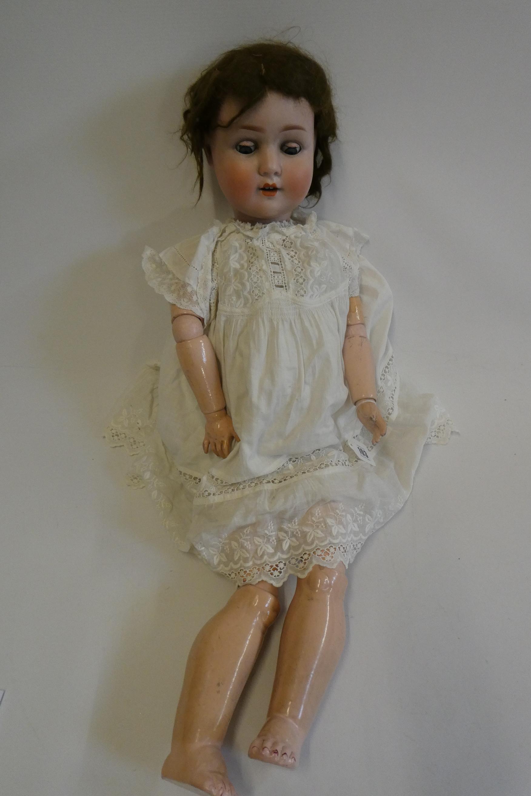 A Schoenau & Hoffmeister bisque socket head doll, with blue glass sleeping eyes, open mouth, teeth, Image