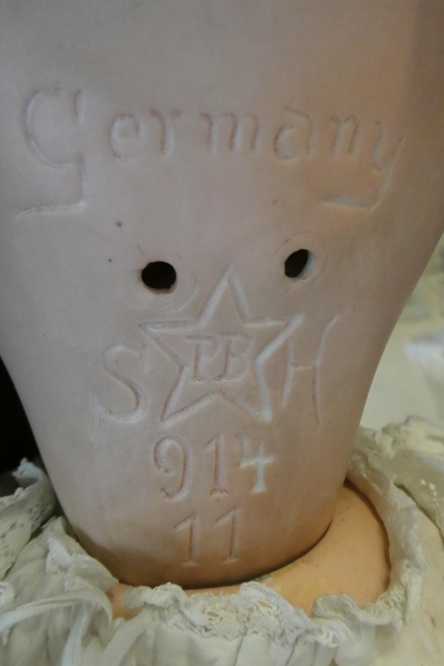 A Schoenau & Hoffmeister bisque socket head doll, with blue glass sleeping eyes, open mouth, teeth, Image