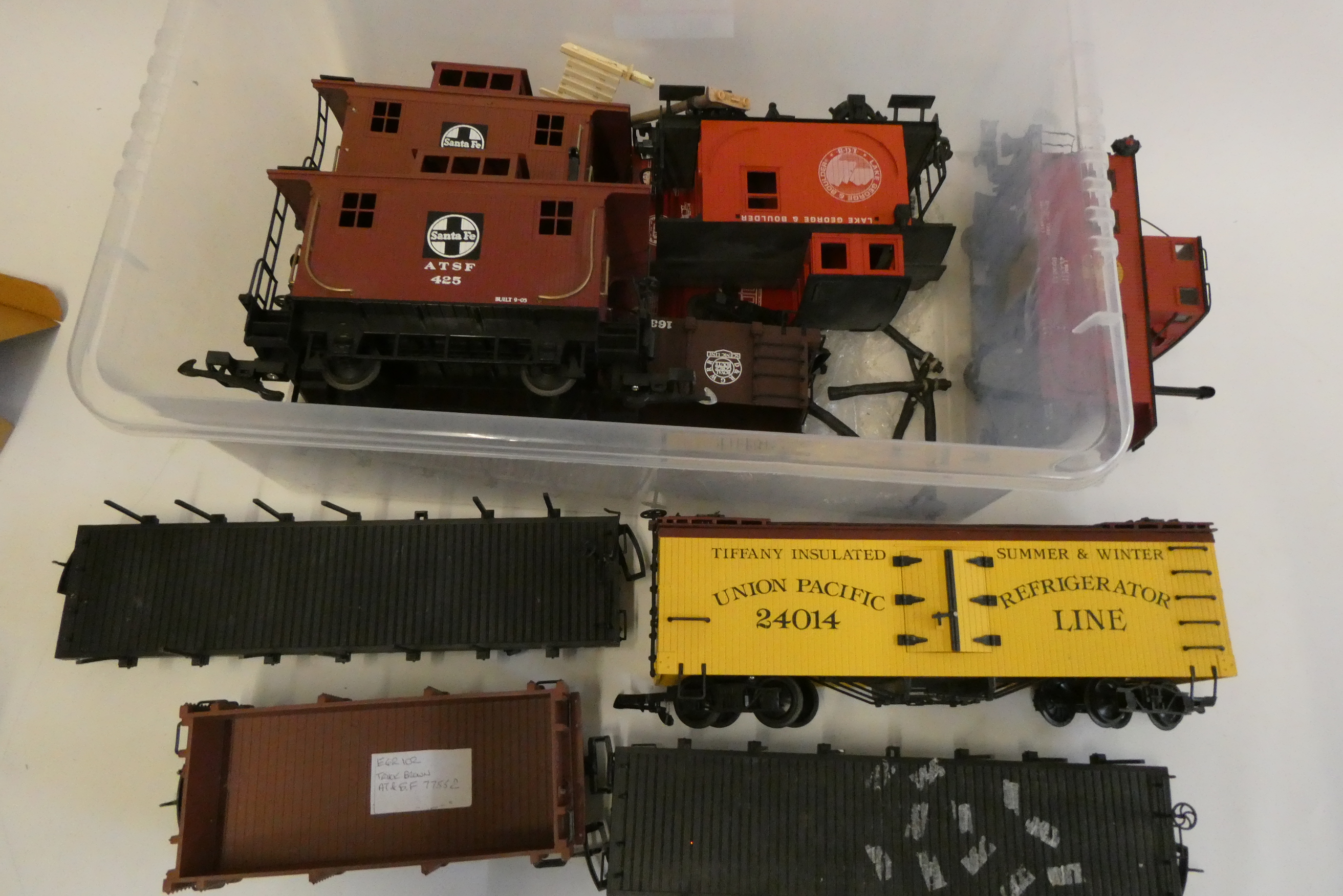 Unboxed American goods wagons by various makers including four boogie box cars, four caboose wagons, Image