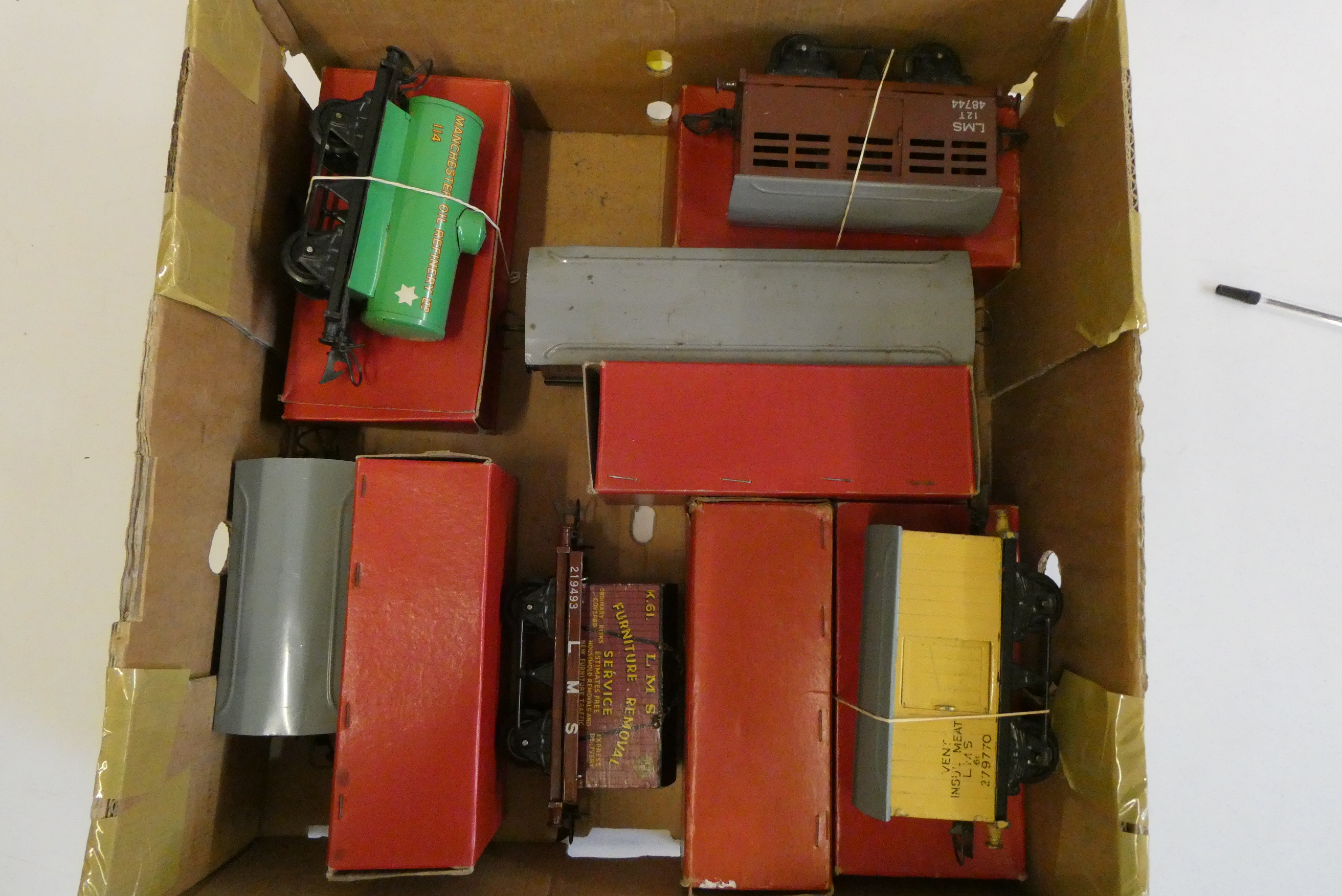 Eight Hornby post war goods rolling stock including tank wagons, cattle van, meat van and container Image