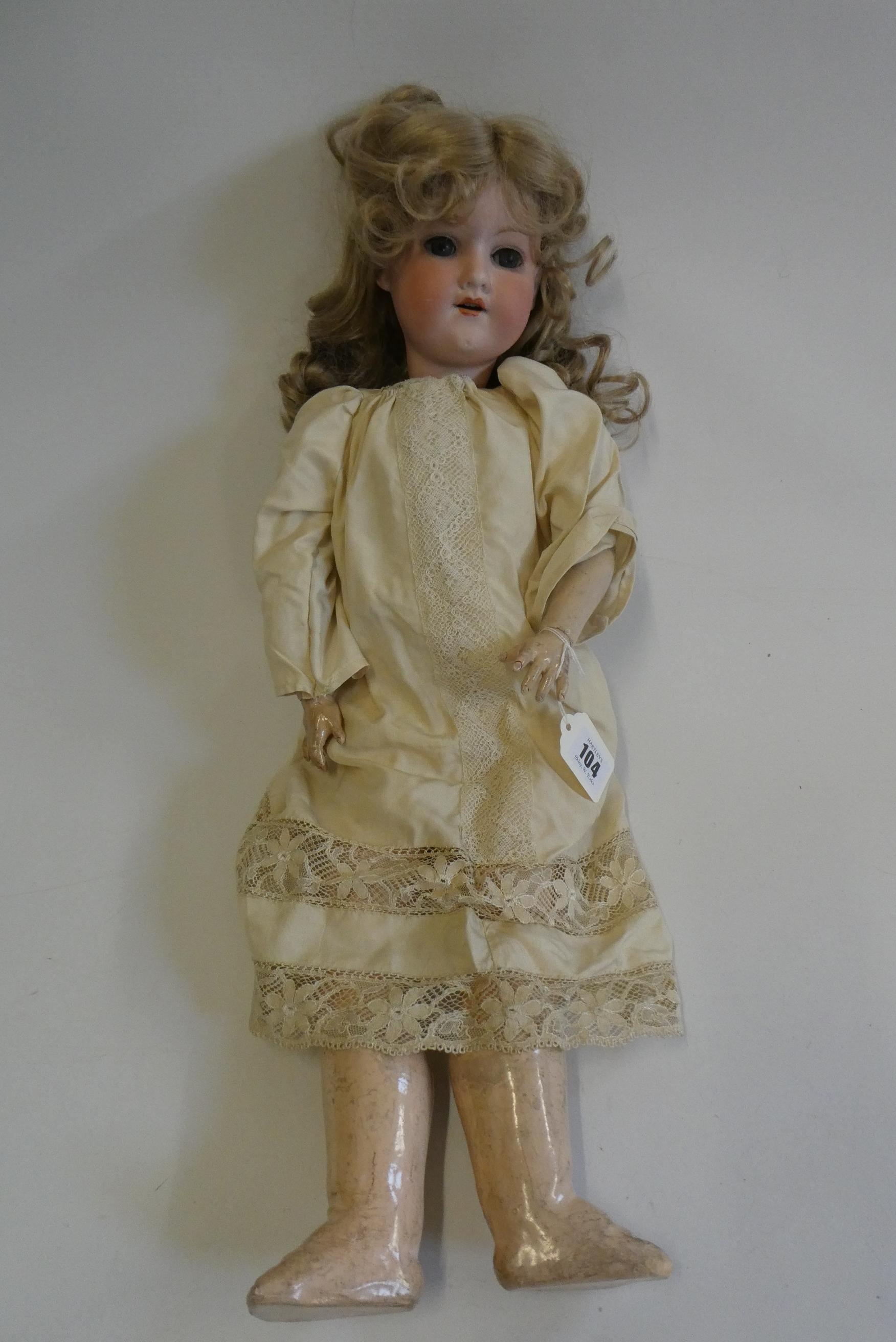 An Armand Marseille bisque socket head doll, with blue glass sleeping eyes, open mouth, teeth, blond Image