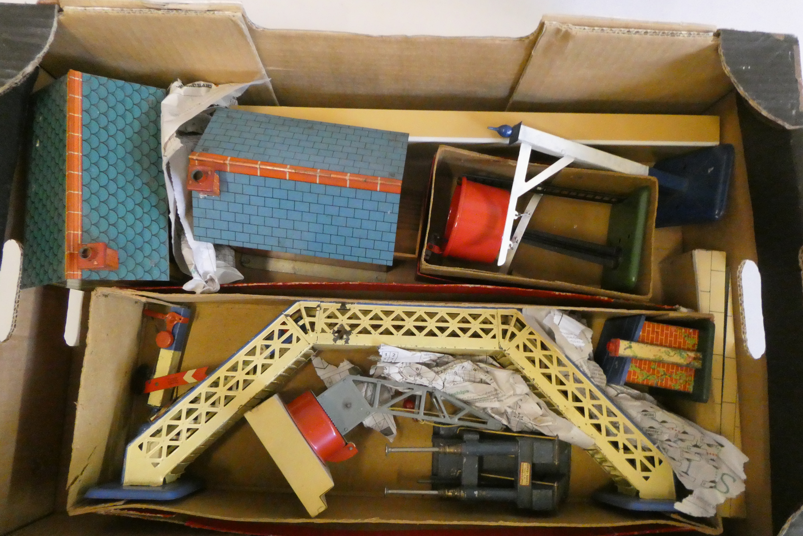 Hornby trackside accessories including two signal boxes, footbridge, water tower and plate layers Image