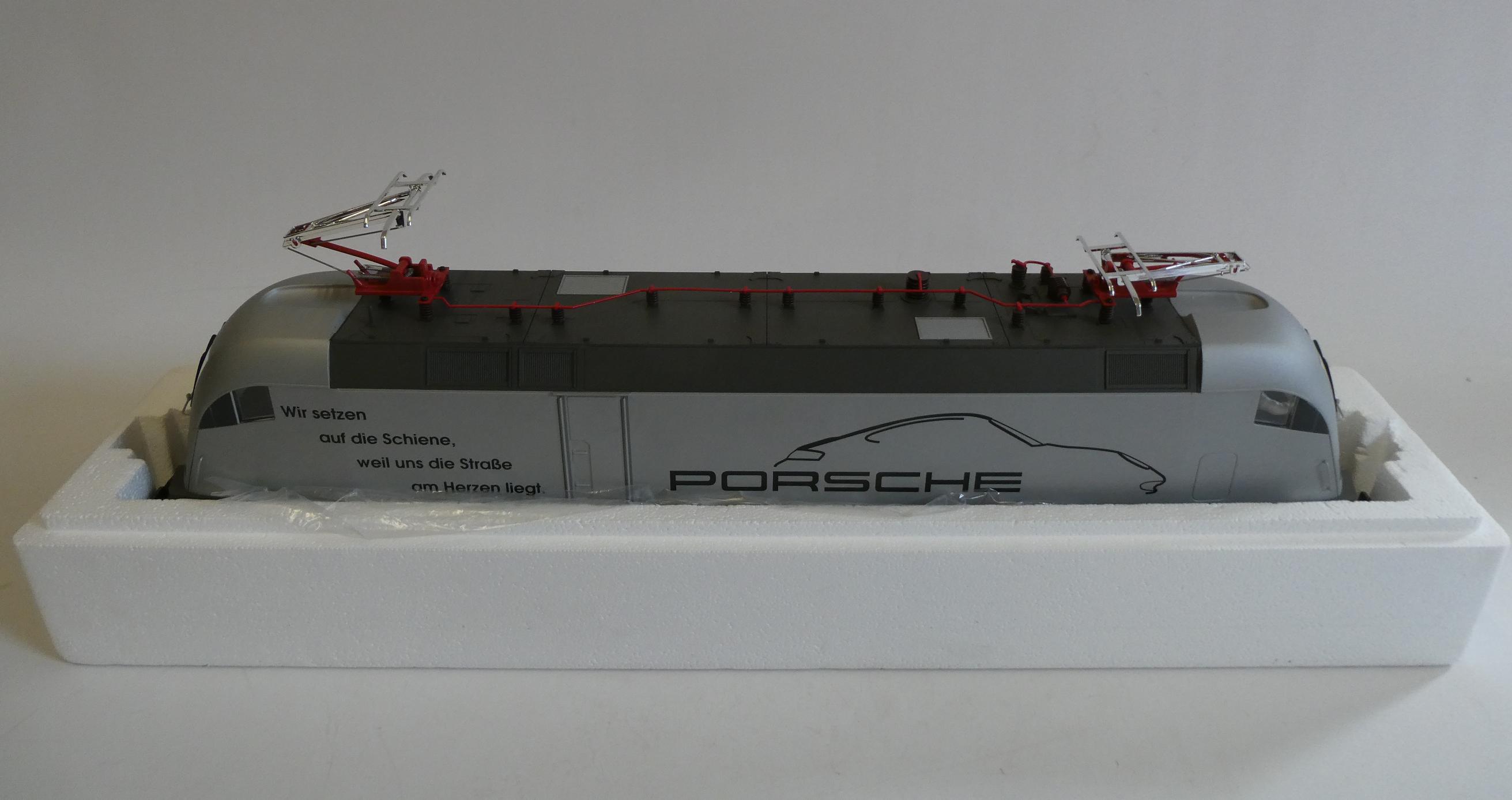 Piko electric German type pentagraph locomotive finished in silver with Porsche livery, boxed, Image