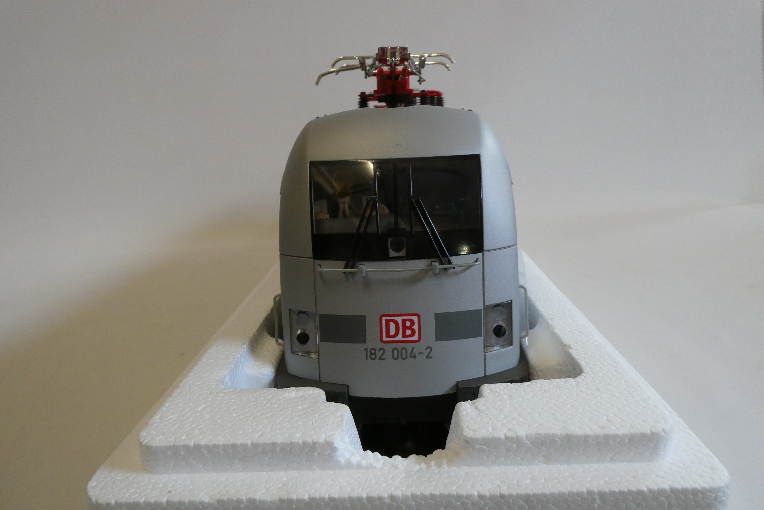Piko electric German type pentagraph locomotive finished in silver with Porsche livery, boxed, Image