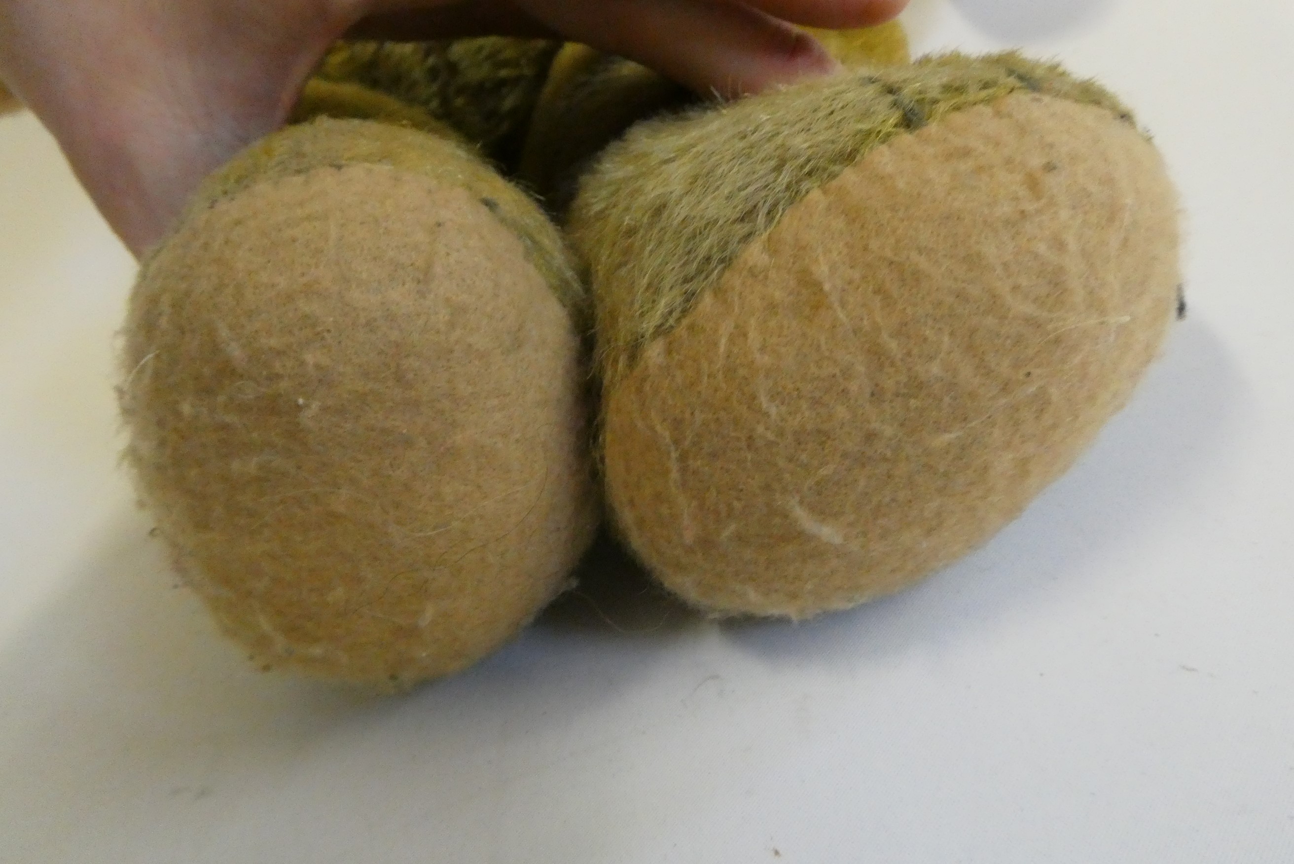 Pre-war jointed teddy bear, with clear glass eyes, orange plush sewn nose and felt pads, 26" long Image