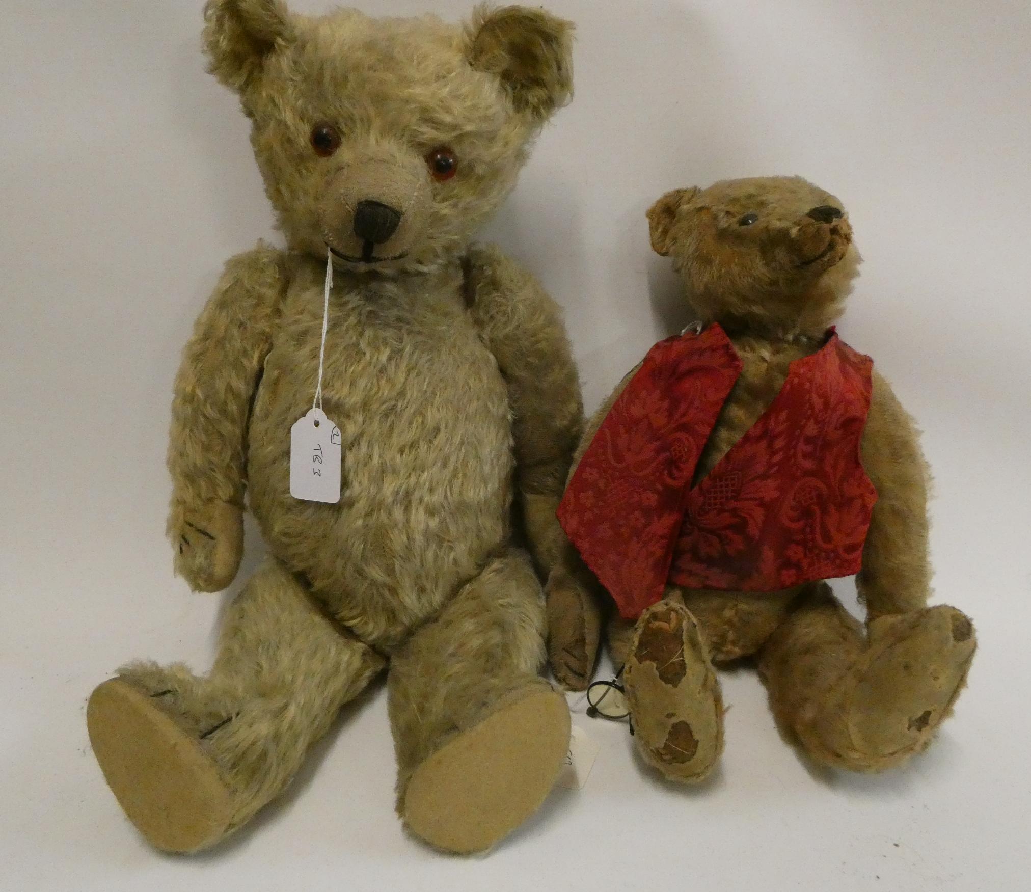 Two old straw filled teddies, comprising a 20" vintage English bear with shaven muzzle, amber eyes Image