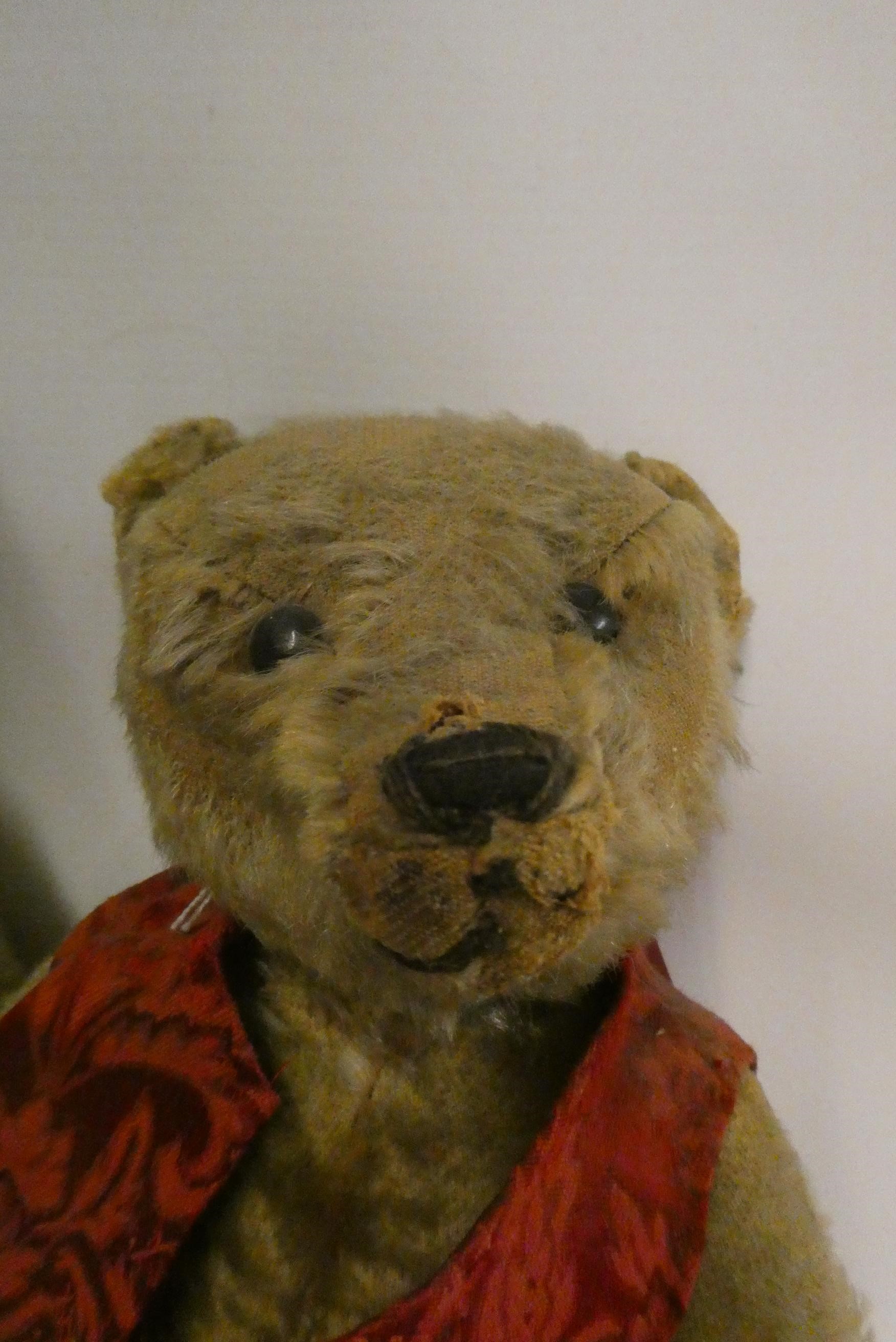 Two old straw filled teddies, comprising a 20" vintage English bear with shaven muzzle, amber eyes Image