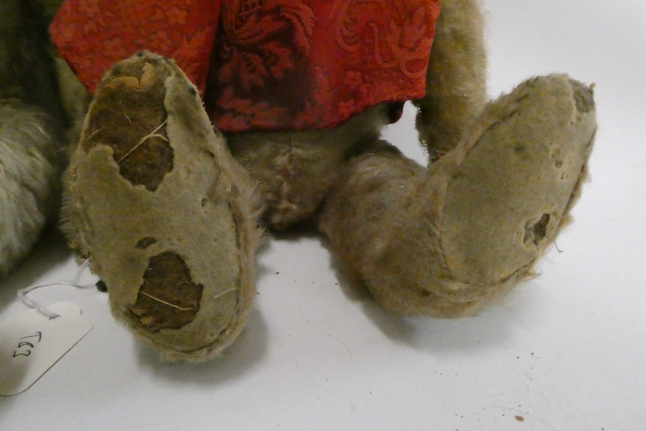Two old straw filled teddies, comprising a 20" vintage English bear with shaven muzzle, amber eyes Image