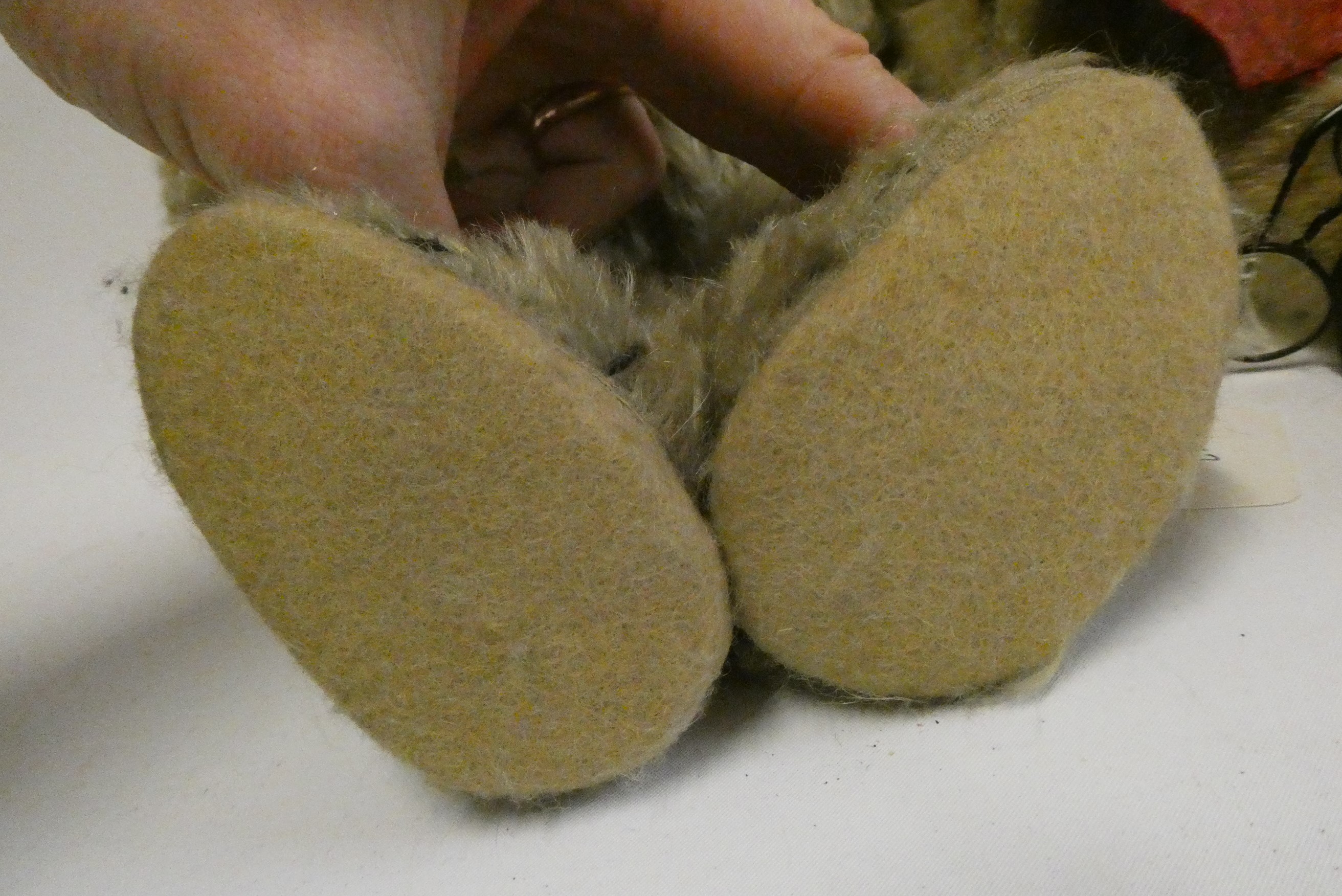 Two old straw filled teddies, comprising a 20" vintage English bear with shaven muzzle, amber eyes Image