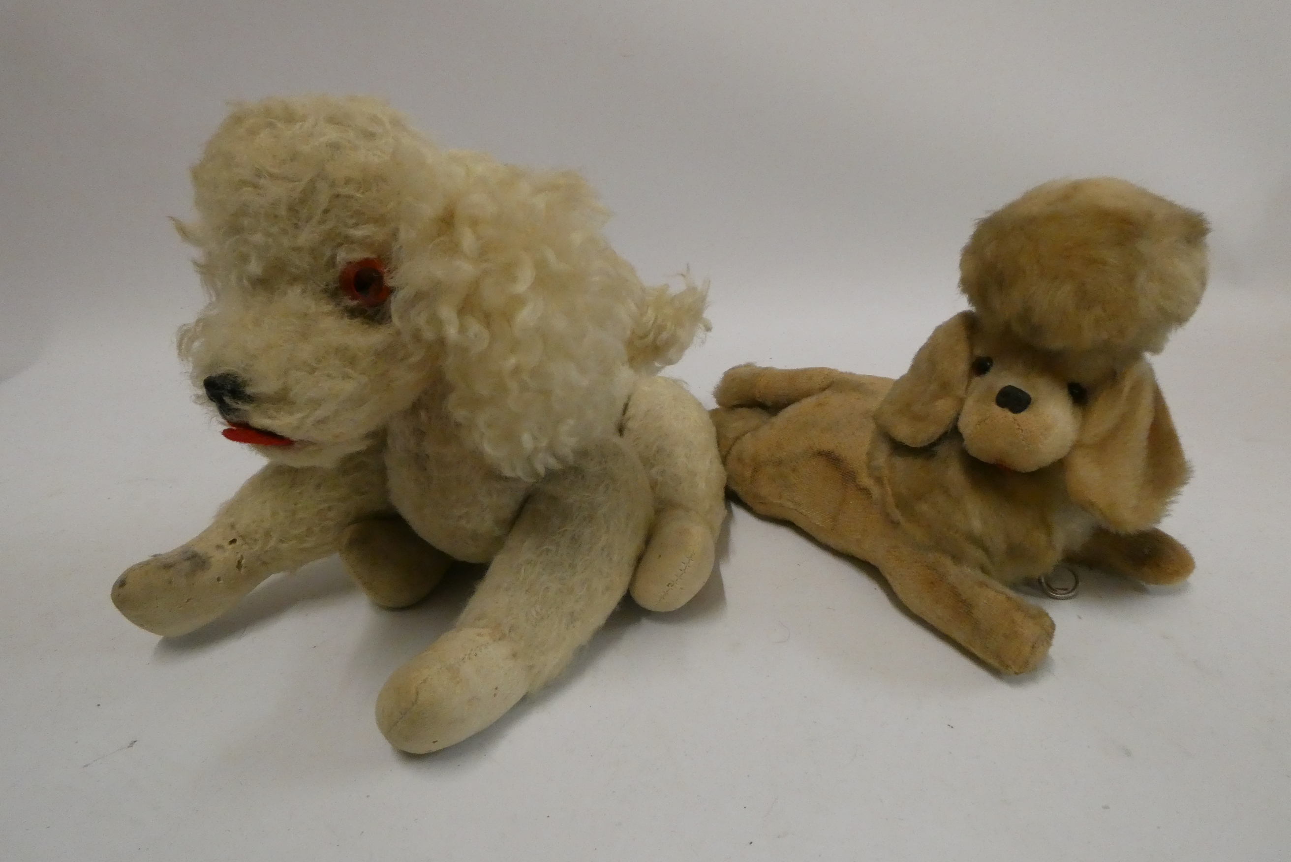 Two vintage automaton musical dogs, both with wind-up clockwork mechanism and heads that move with Image