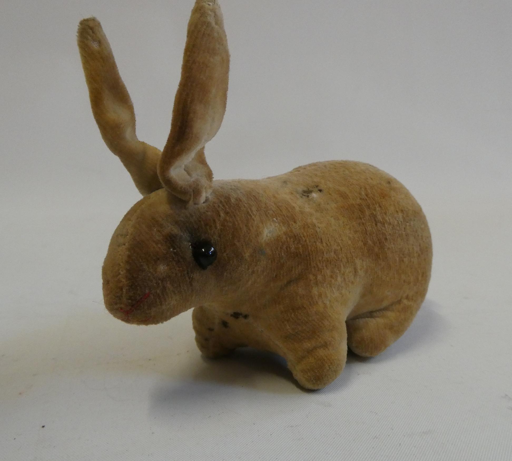 An early velvet rabbit, possibly Steiff, with shoe button eyes, 5" long Image