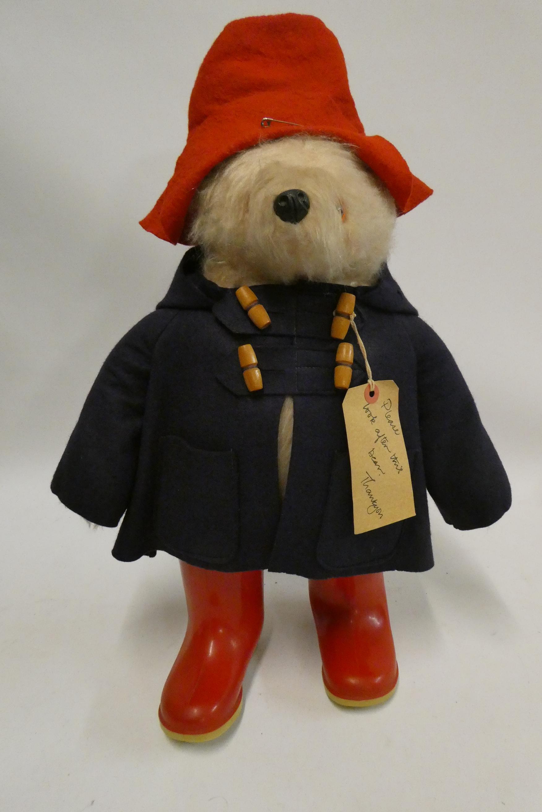 Paddington bear, with amber eyes, red felt hat, blue felt coat, red Dunlop boots and card label, 18 Image